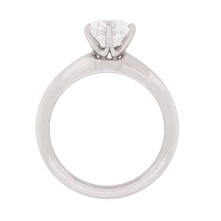 A stunning engagement ring as a classic solitaire. This ring from Tiffany & Co features a beautiful diamond weighing 1.34 carat set within a claw setting. It has been certified as an E in colour and VS2 in clarity, which is exquisite quality. It is
