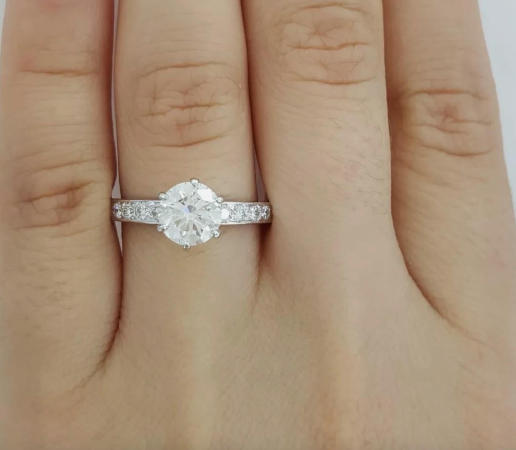 Diamond cut: Round Brilliant 
Carat: 1.39 carats
Measurements: 6.66-6.68 x 4.10 mm
Color: H
Clarity: VVS1
Cut: Excellent
Polish: Excellent
Symmetry: Excellent
Fluorescence: None
Inscription: T&Co. (Serial number) on crown 

Small Diamonds
Carat: