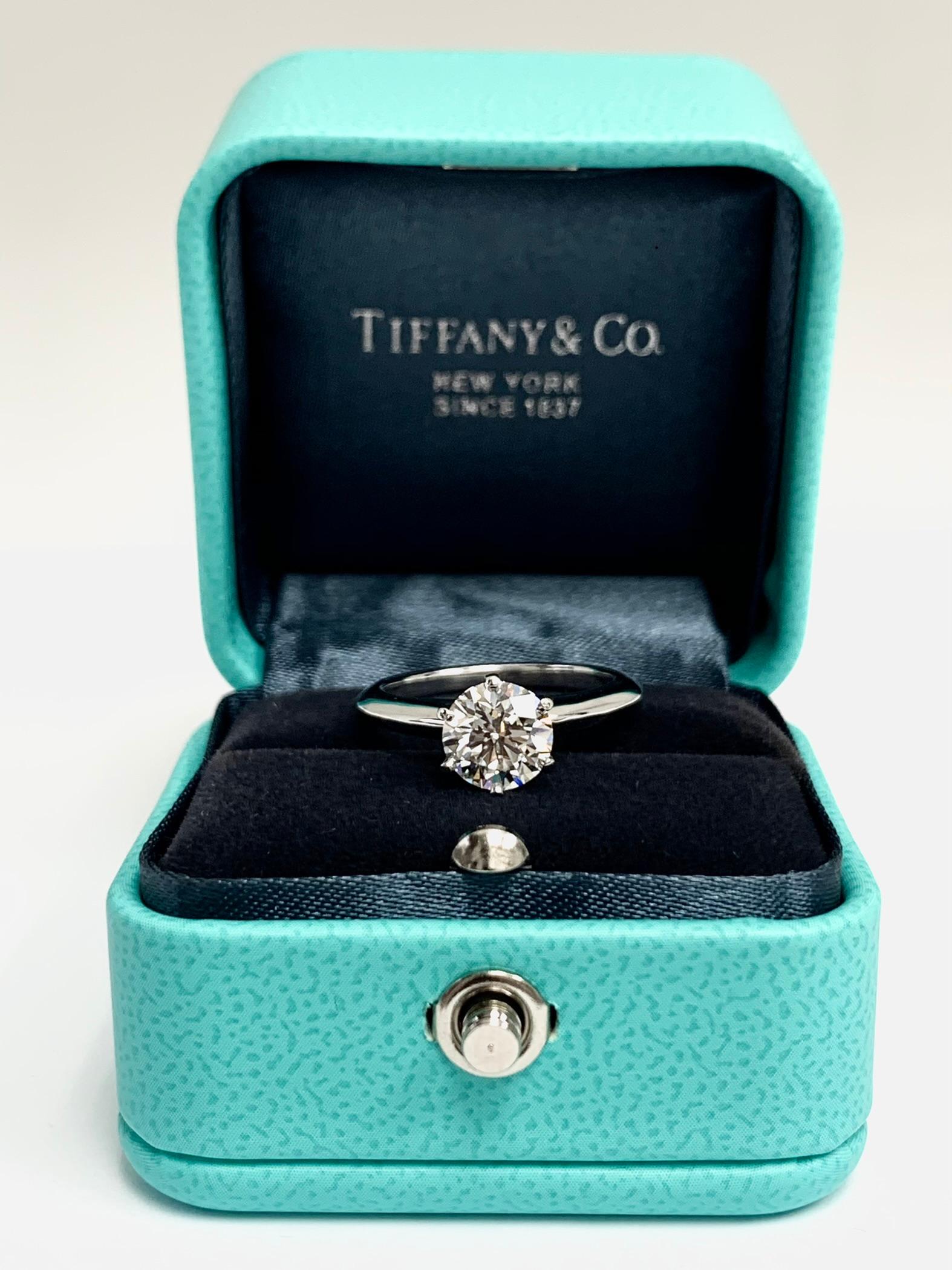 Classic Tiffany & Co Round Brilliant cut diamond set as a Solitaire Engagement Ring featuring a 1.39 ct Center graded
with a G color and Internally Flawless (IF) clarity grade, Triple Excellent Cut. Finely crafted in a 6 prong Platinum Mounting.
(