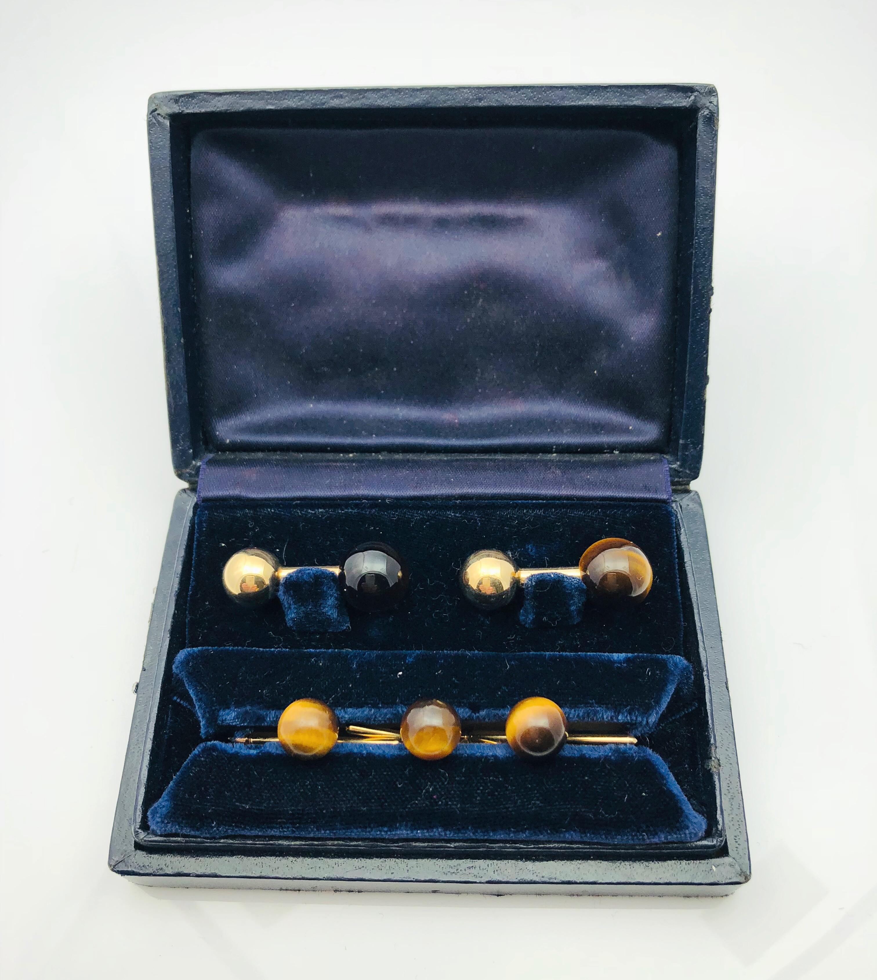 Gorgeous Tiffany & Co. 14k yellow Gold and Tiger's Eye Cufflink and Stud Tuxedo set in original Box. The Cufflinks are one inch long and each have a 10mm yellow gold ball on one end and a 12 mm tiger's eye on the other end. They are stamped Tiffany