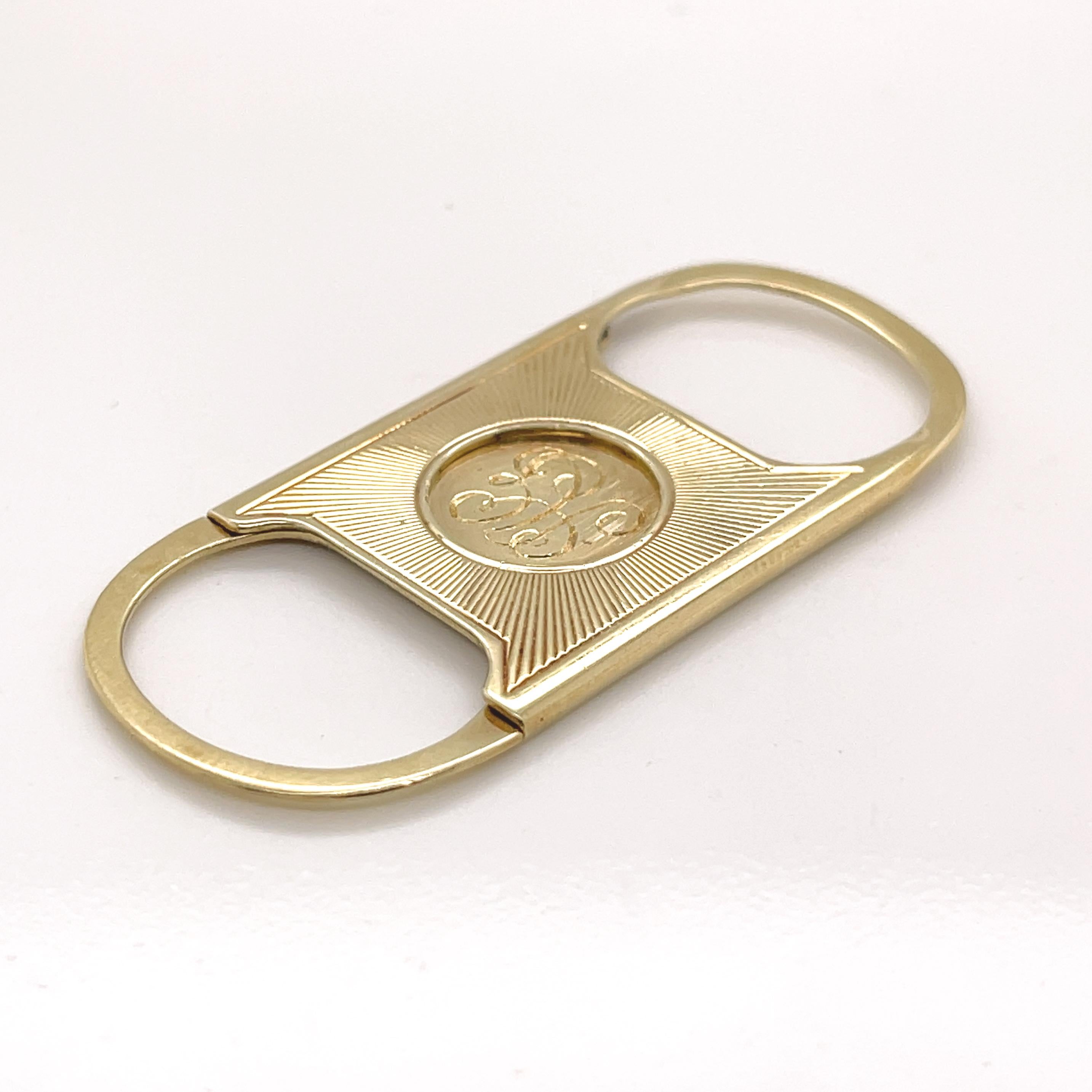 A very fine 14k gold cigarillo or cigar cutter.

By Tiffany & Co. 

A so-called Guillotine or straight-cut cutter.

With an engraved monogram.

The opening for the cigar is approx. 11.5 mm (or just about 0.45 inches) in diameter.

Simply a great