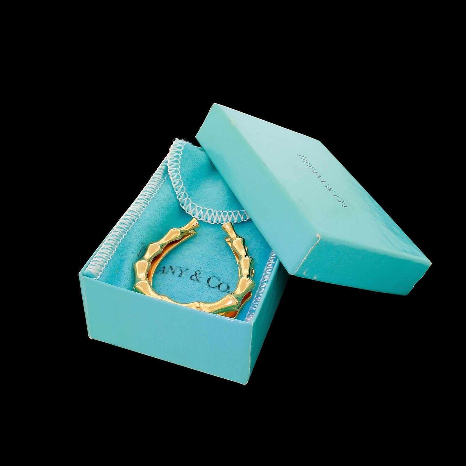 Rare Horseshoe variation from the Tiffany & Co Bamboo line, this particular design seldomly seen and very rarely comes up for sale.
This piece although pre-owned is in very good to excellent condition, no mongrams either applied removed and when you