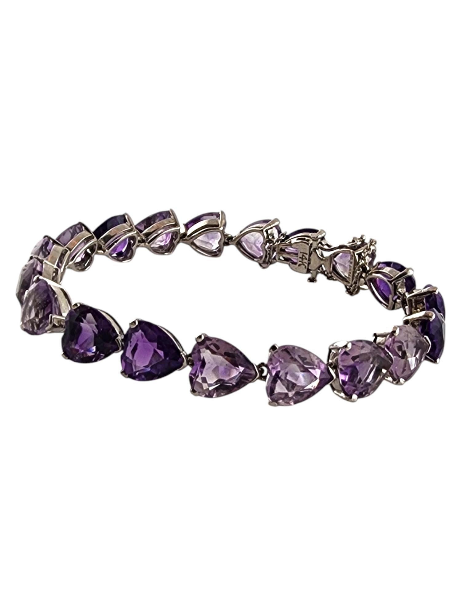 Tiffany & Co 14 Karat White Gold Purple Amethyst Heart Bracelet

Tiffany & Co designed this gorgeous bracelet with 19 stunning purple amethyst heart shaped stones all set in 14K white gold!

Size: 6 3/4