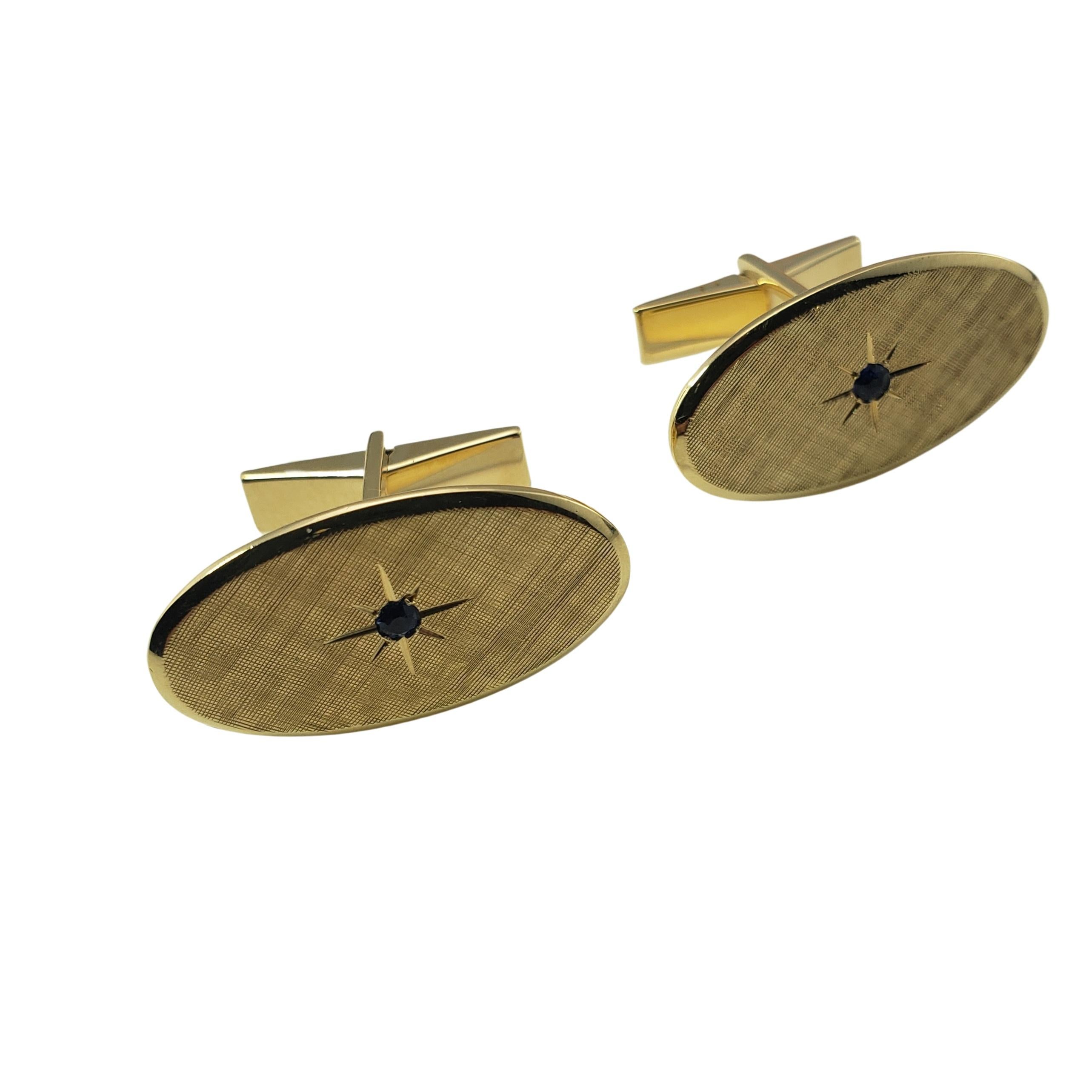 Tiffany & Co. 14 Karat Yellow Gold and Sapphire Cufflinks-

These elegant cufflinks by Tiffany & Co. each feature one round sapphire (2 mm) set in beautifully detailed 14K yellow gold.  

*Matching tie pin: RL-00011920

Size: 1 inch x 1/2