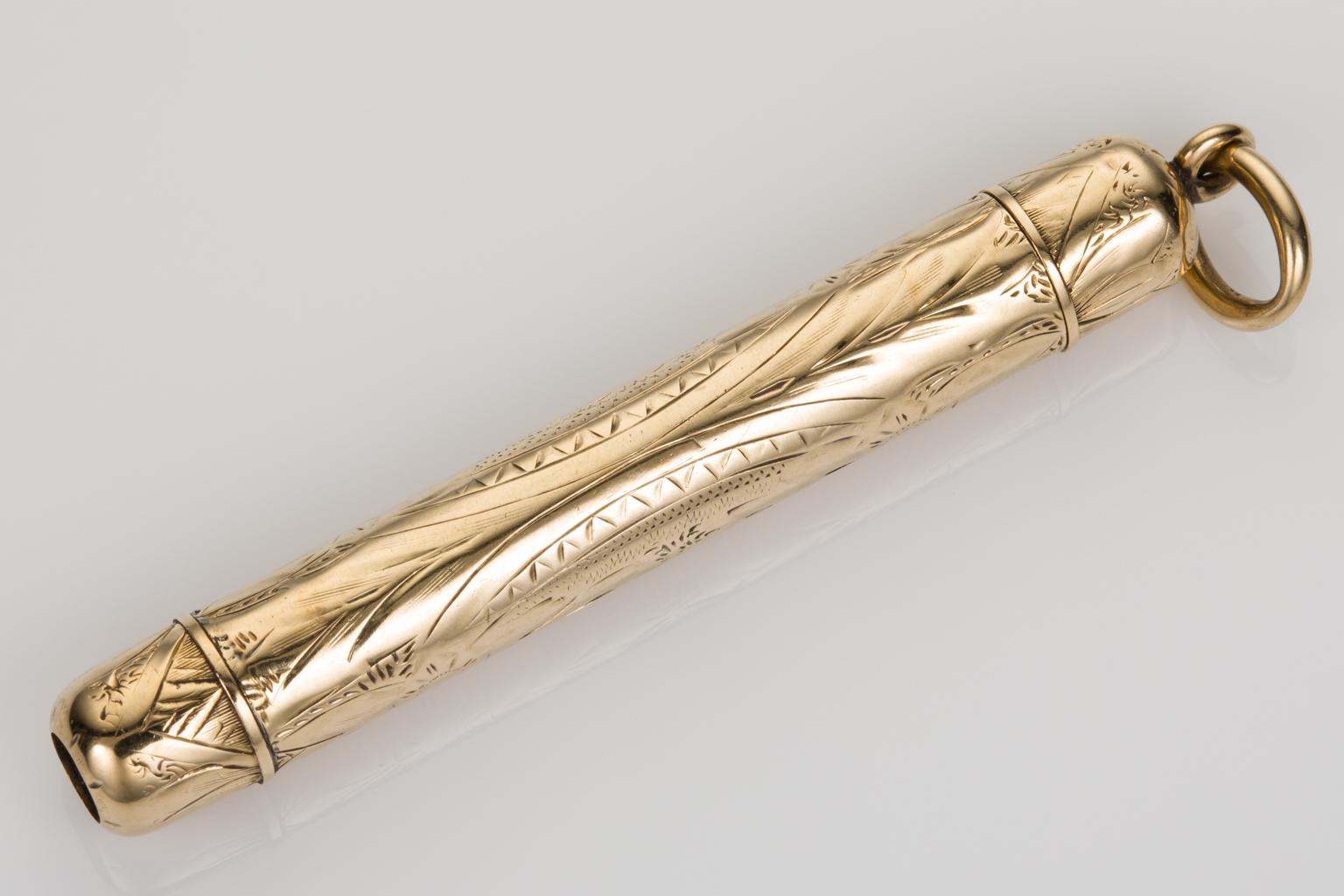 How wonderful is this piece, an antique 14k yellow gold Tiffany & Co signed retractable pencil. The outer case is embellished with beautiful hand engraving that covers the entire piece. When it is closed it measures 2 1/2 inches (6.35cm) including