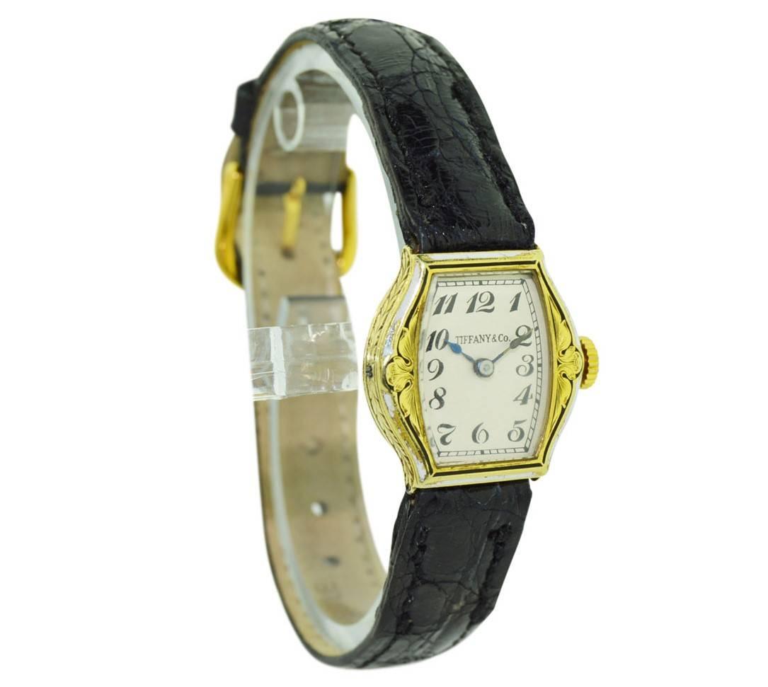 FACTORY / HOUSE: Tiffany & Co / Cressarrow 
STYLE / REFERENCE: Art Deco / Engraved / Enameled
METAL / MATERIAL: 14Kt. Solid Gold
CIRCA: 1920's
DIMENSIONS: 22mm X 21mm
MOVEMENT / CALIBER: Manual Winding / 167Jewels 
DIAL / HANDS: Silvered with Kiln