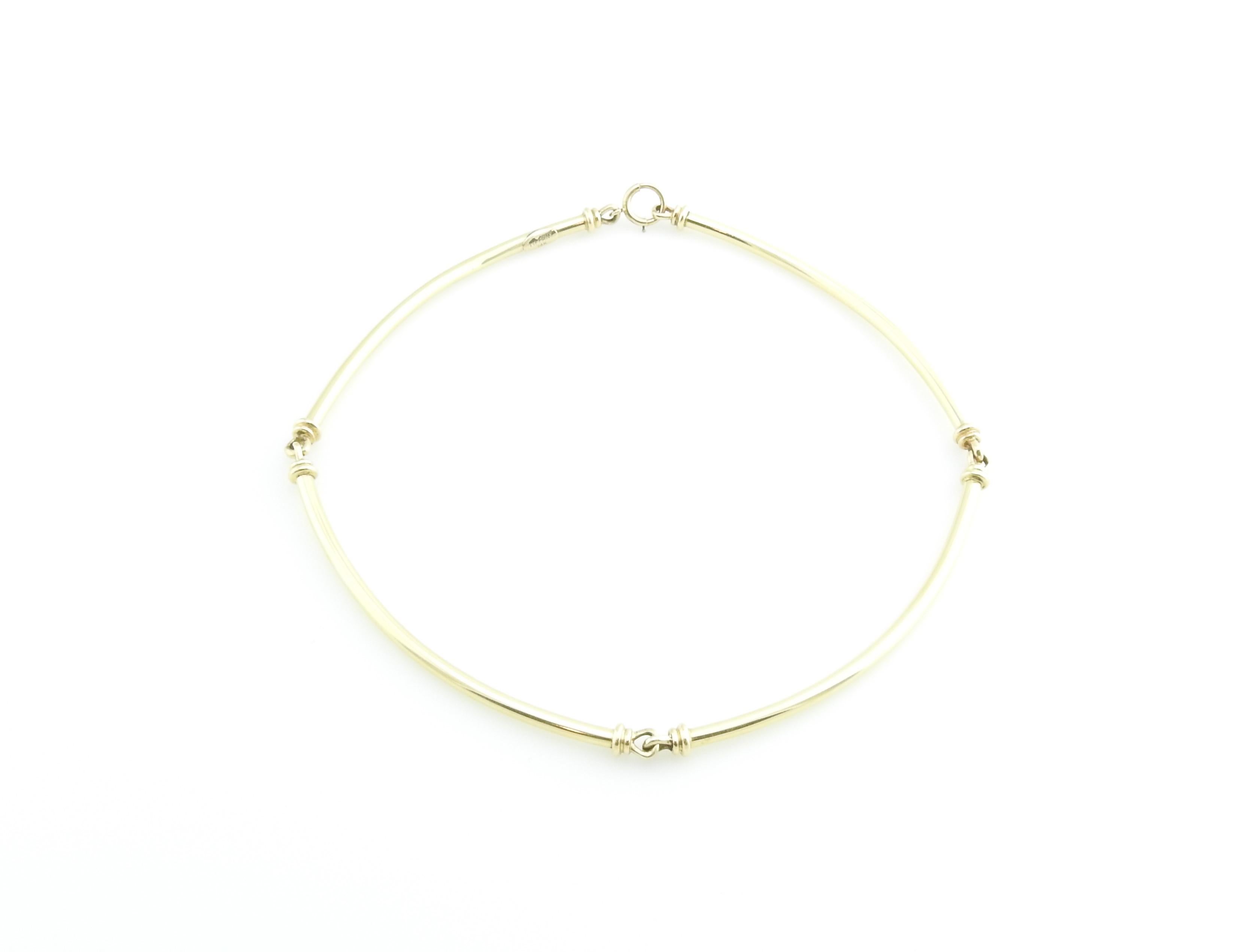 Vintage Tiffany & Co. 14 Karat Yellow Gold Necklace Choker 

This stunning bar link choker necklace is crafted in meticulously detailed 14K yellow gold. Spring ring closure. Width: 3 mm.

Size: 14.5 inches

Weight: 12.2 dwt. / 19.0 gr.

Hallmark: