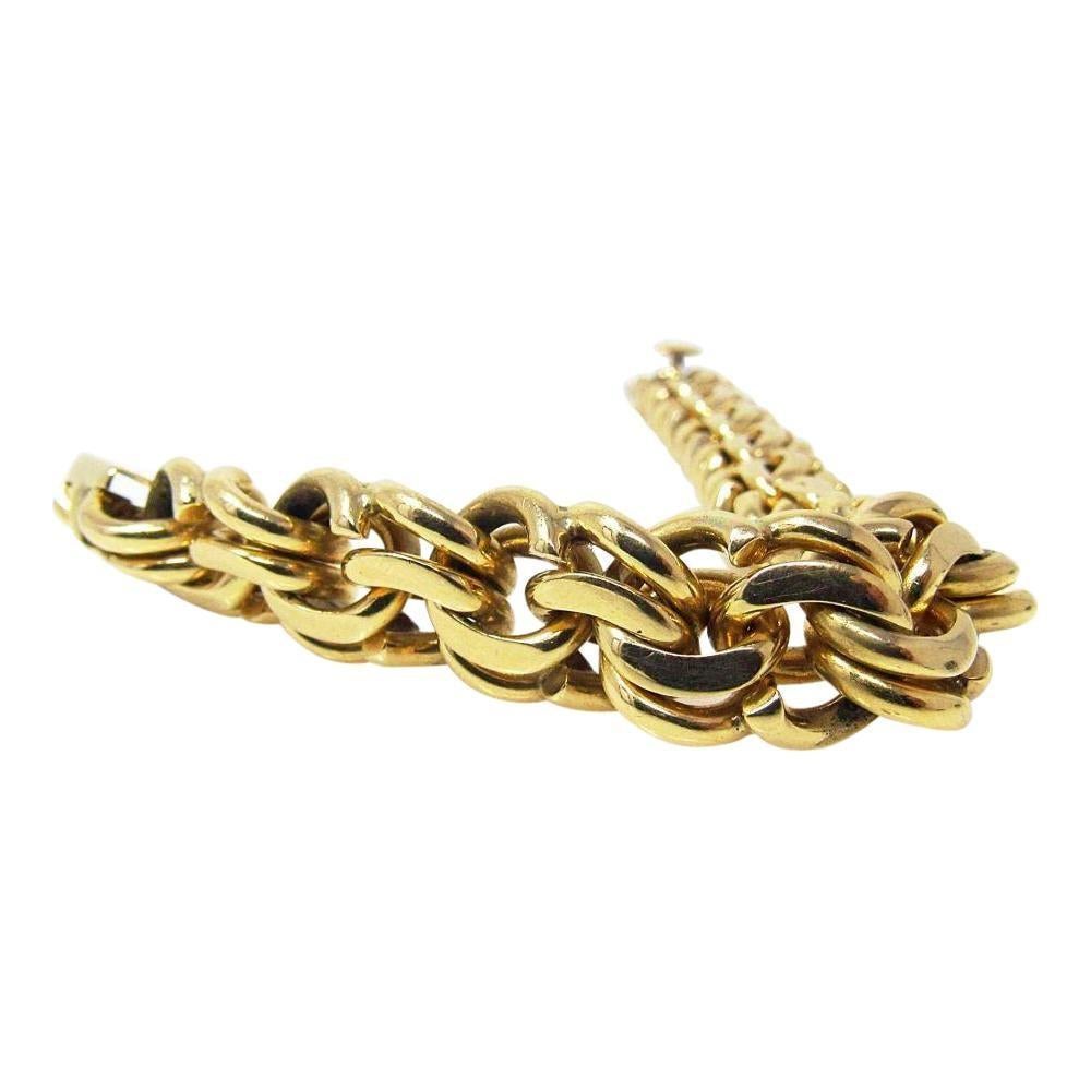 Tiffany and Company 14K yellow gold charm link bracelet.  1950's very sturdy heavy gauge link. The bracelet is in excellent condition, fully signed Tiffany & Co. and has tested positive for solid 14K gold.

7.25” long, 1/2