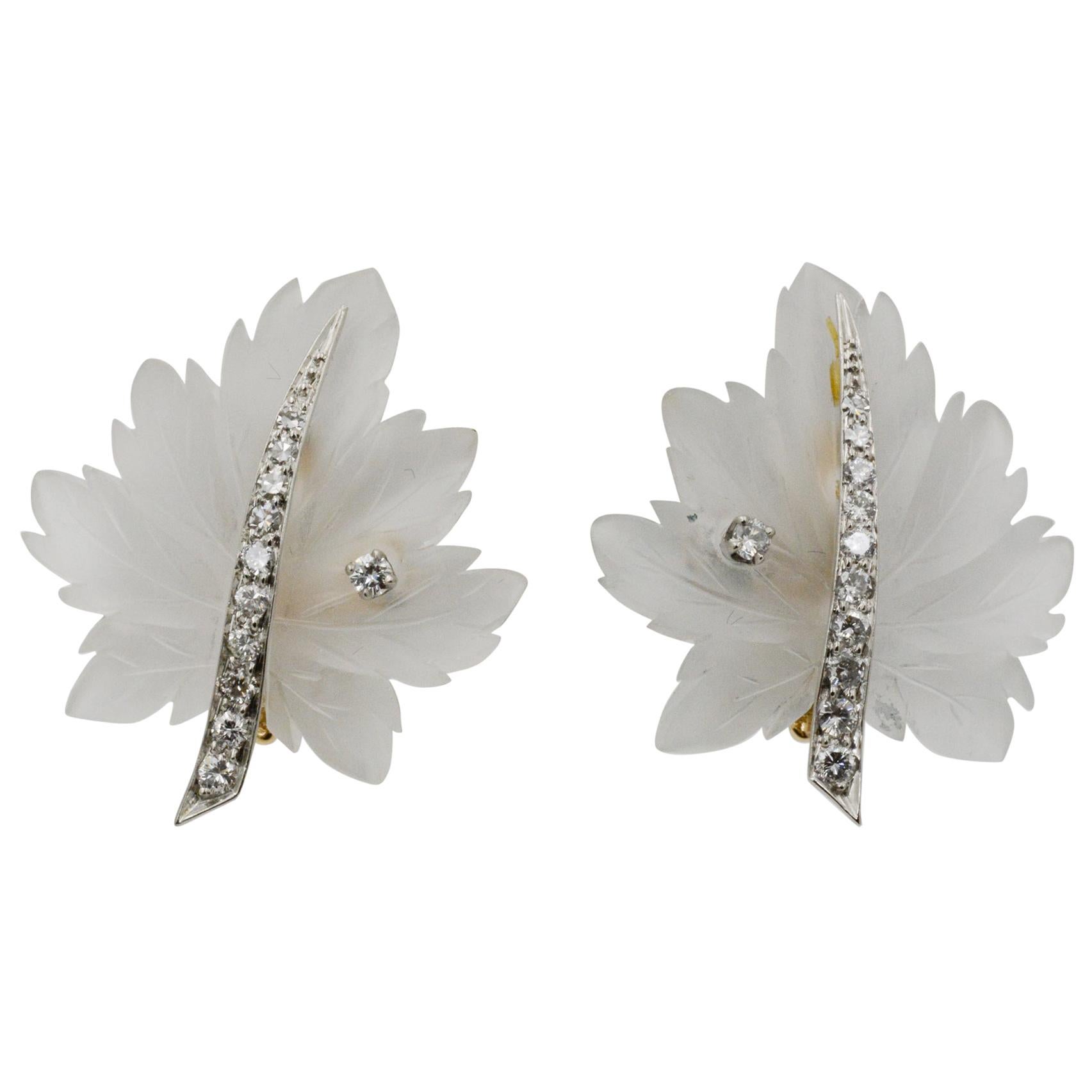 Exclusively from the Eiseman Estate Jewelry Collection, these Tiffany & Co. 14k yellow gold earrings feature a rock crystal leaf design and 22 round brilliant cut diamonds, weighing a total of .44ctw with HI coloring and SI clarity. The earrings are