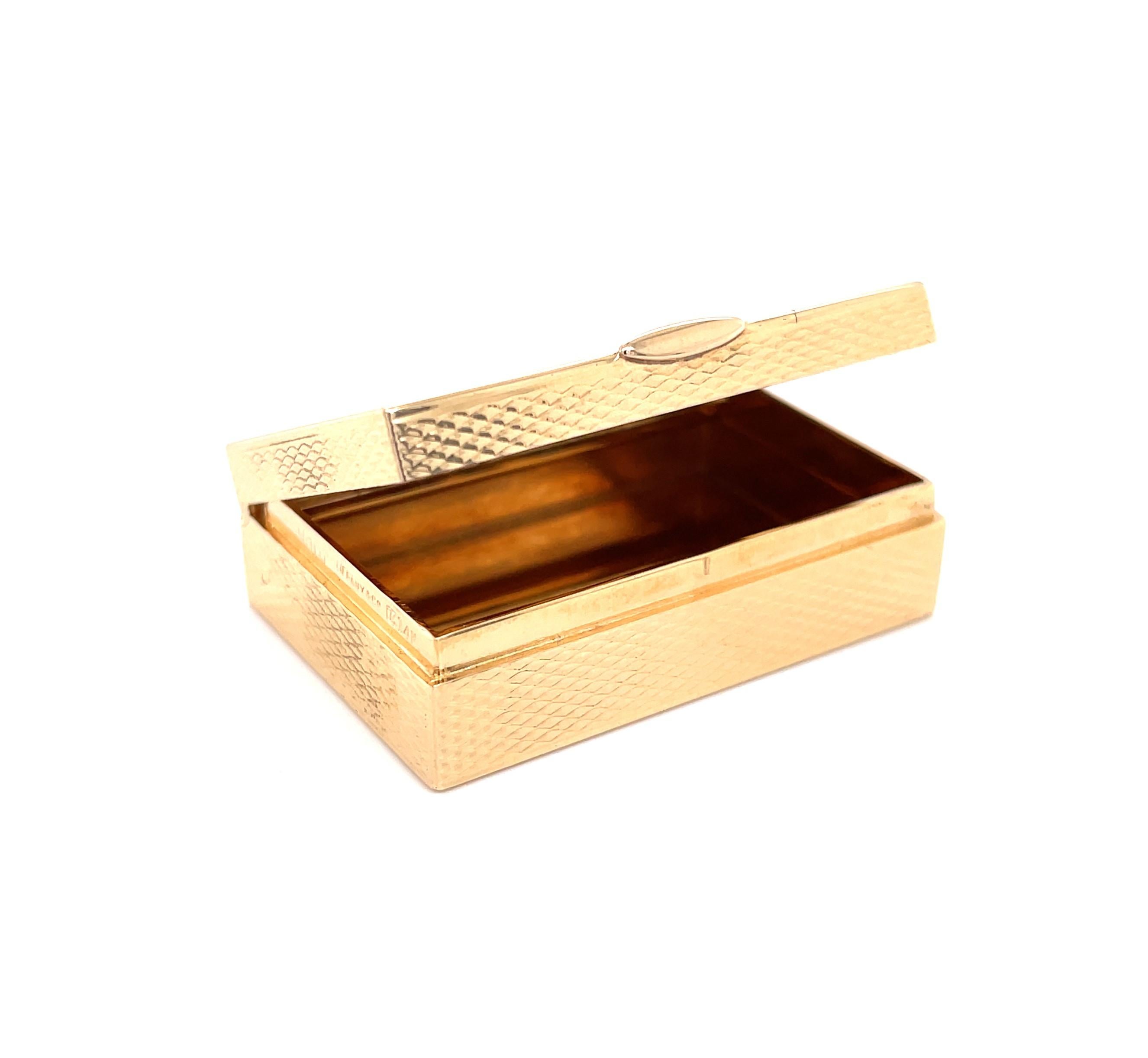 Indulge on a daily basis with this vintage Tiffany & Co. fourteen karat 14k yellow gold pill box. A finer item for the personal elegance of transporting your pharmaceuticals in style. The textured finish of this diamond engraved miniature pill box