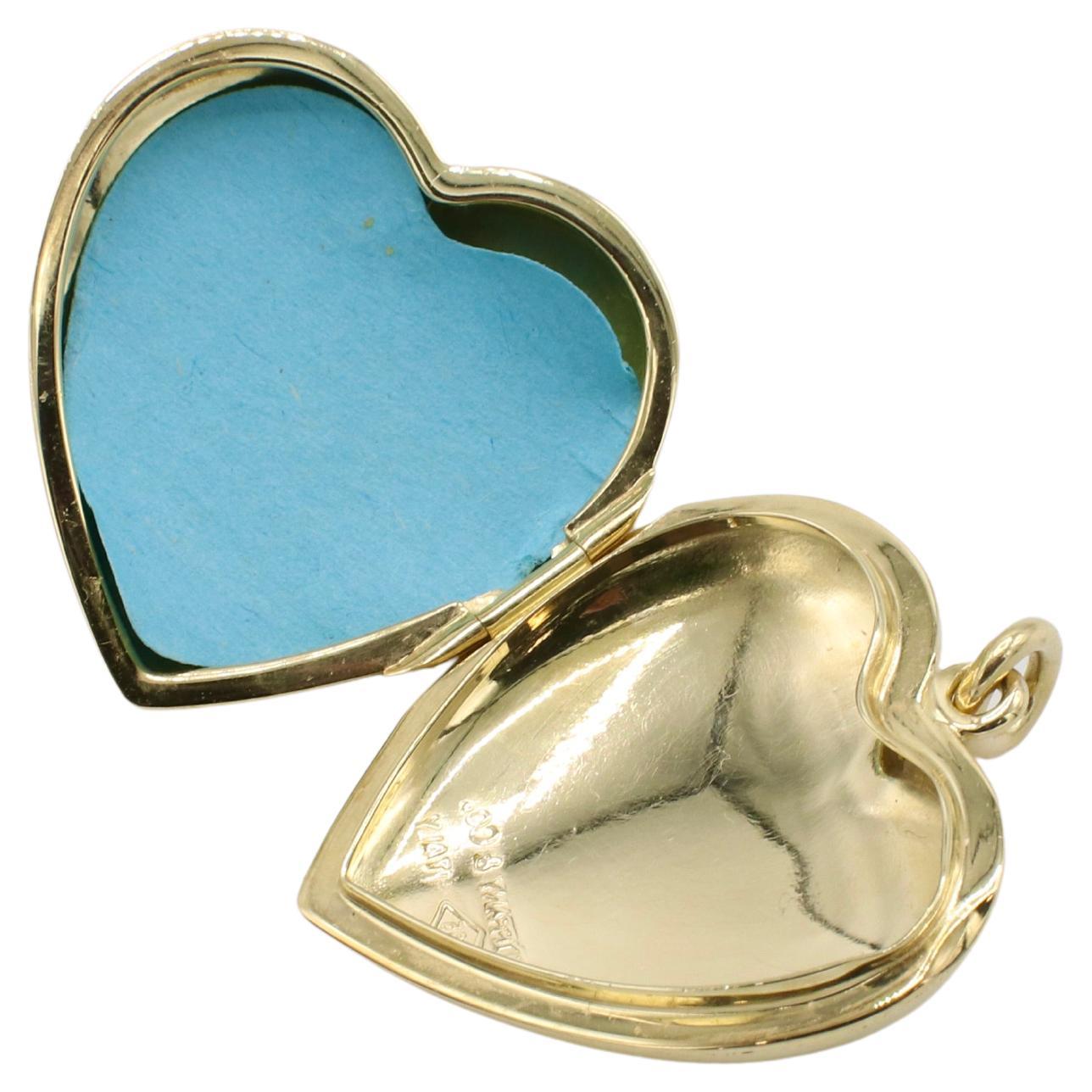 Tiffany & Co. 14 Karat Yellow Gold Puffed Heart Locket Pendant Charm
Metal: 14k yellow gold
Weight: 10.30 grams
Dimensions: 27 x 30mm
Bail opening: 4.5mm
Signed: Tiffany & Co. 585 ITALY