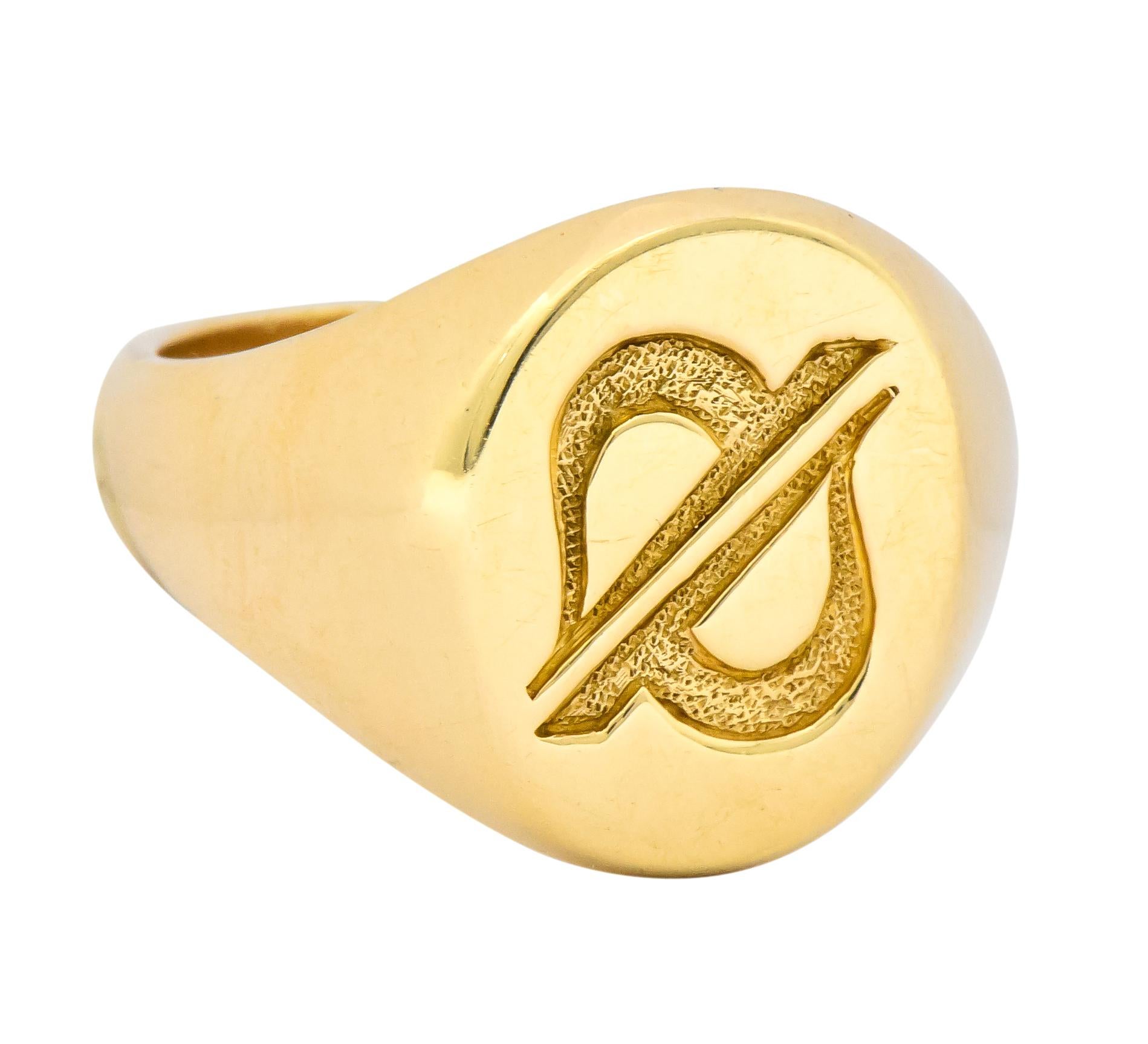 Classic signet style ring featuring a high polished finish and an deeply engraved oval head 

Depicting a stylized zodiac sign for Cancer completed by a stippled texture 

Fully signed Tiffany & Co. and stamped 14k for 14 karat gold 

Circa: