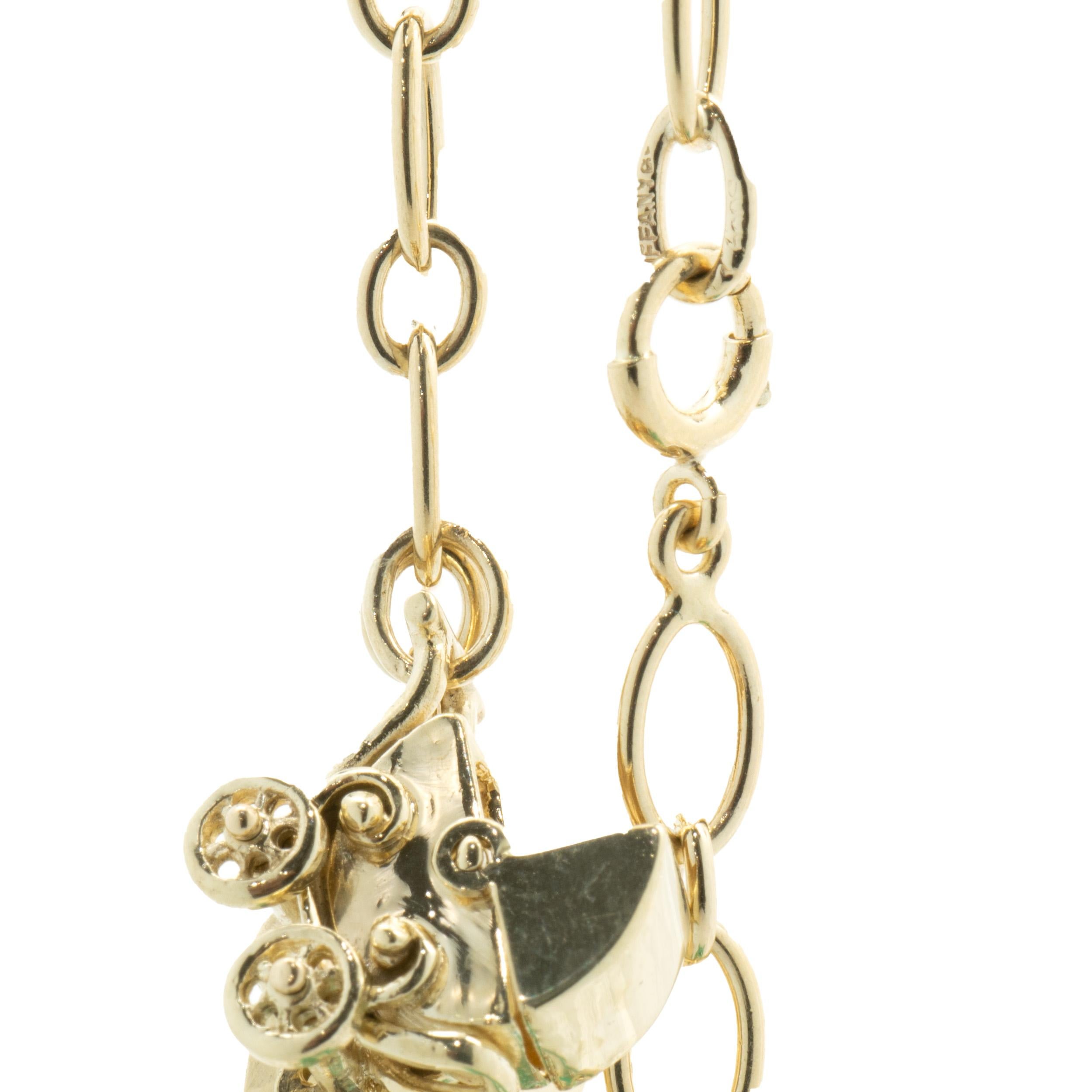 Tiffany & Co. 14 Karat Yellow Gold Vintage Charm Bracelet In Excellent Condition In Scottsdale, AZ