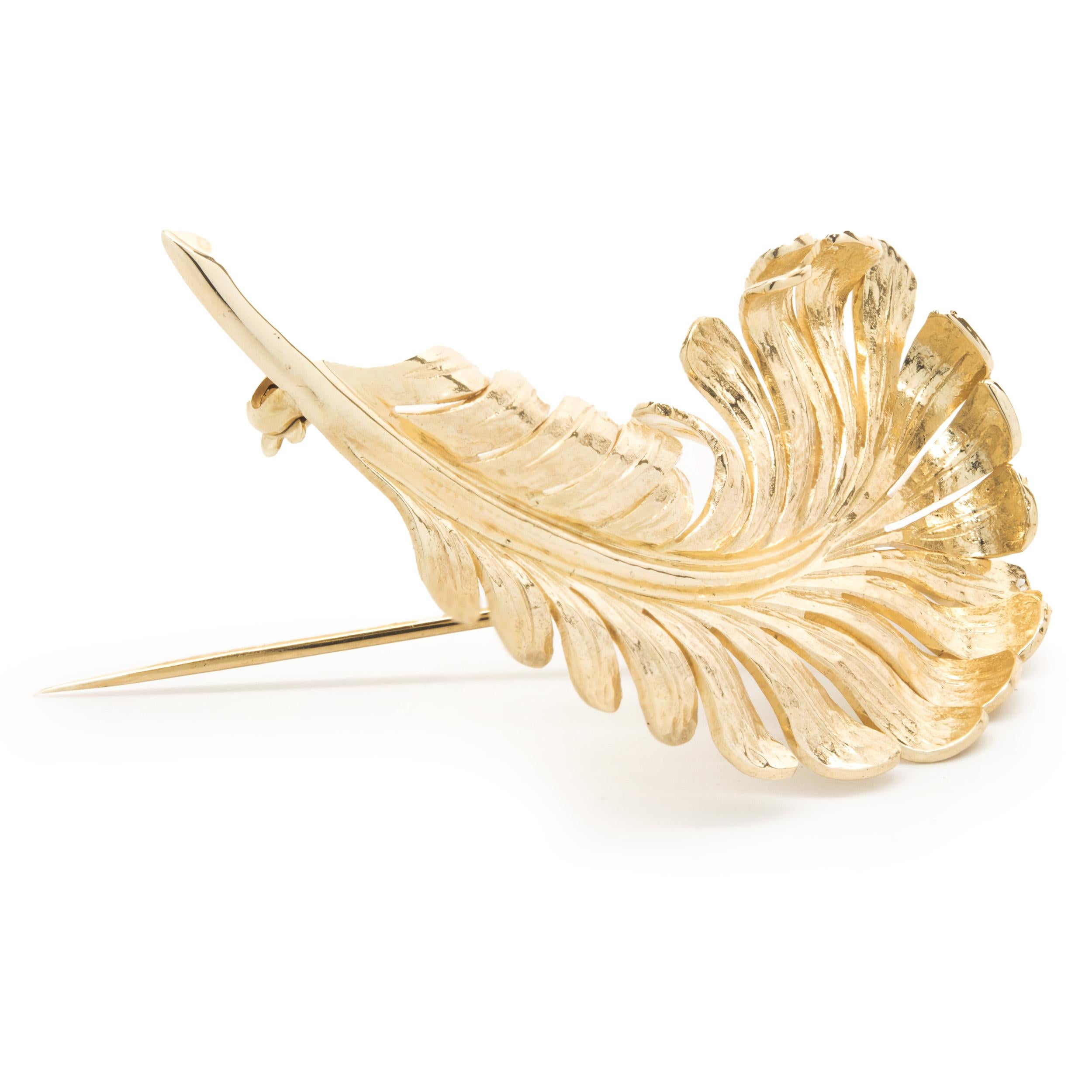 Designer: Tiffany & Co. 
Material: 14K yellow Gold 
Dimensions: feather measures 71 x 30mm
Weight: 15.67 grams
