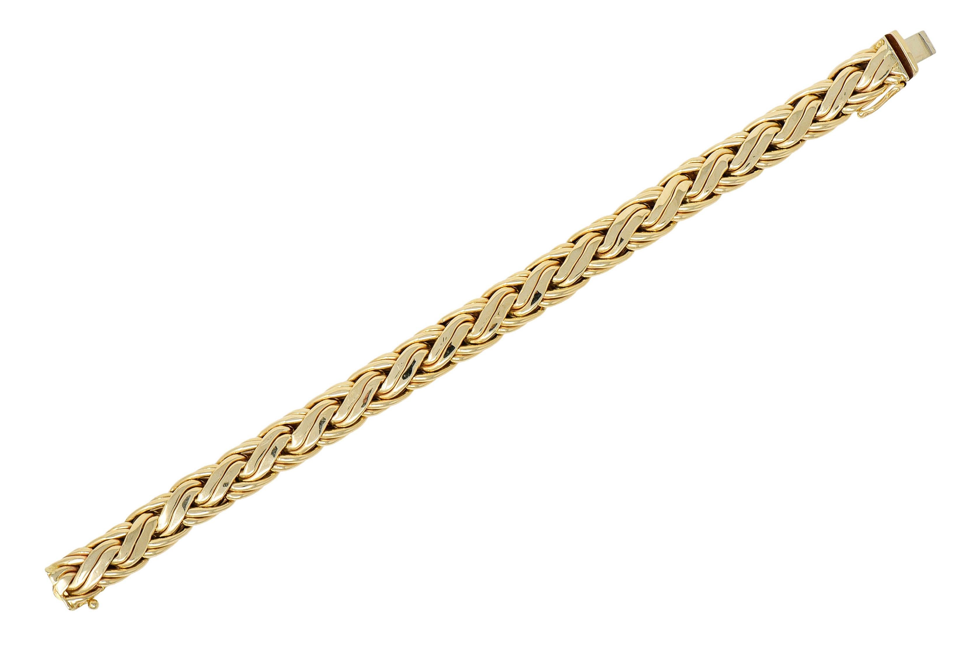 Designed as a woven chain bracelet

With polished gold S style links

Completed by a concealed clasp with figure eight safety

Fully signed Tiffany & Co.

Stamped 585 for 14 karat gold

Circa: 1970s

Length: 7 1/2 inches

Width: 3/8 inch

Total