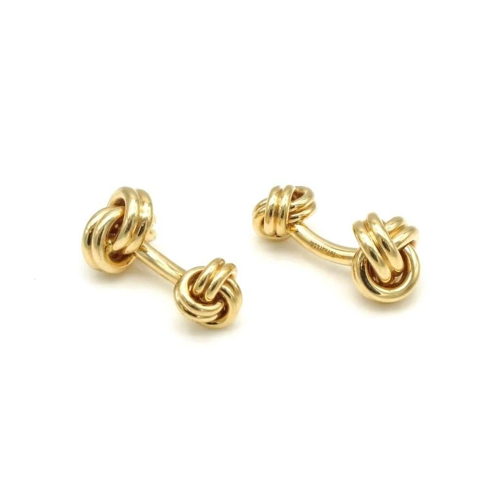 TIFFANY & Co. 14K Gold Love Knot Cuff Links Cufflinks

Metal: 14K Yellow Gold 
Weight: 21.60 grams
Hallmark: TIFFANY&CO.  585

Limited edition, no longer available for sale in Tiffany stores

Authenticity Guaranteed