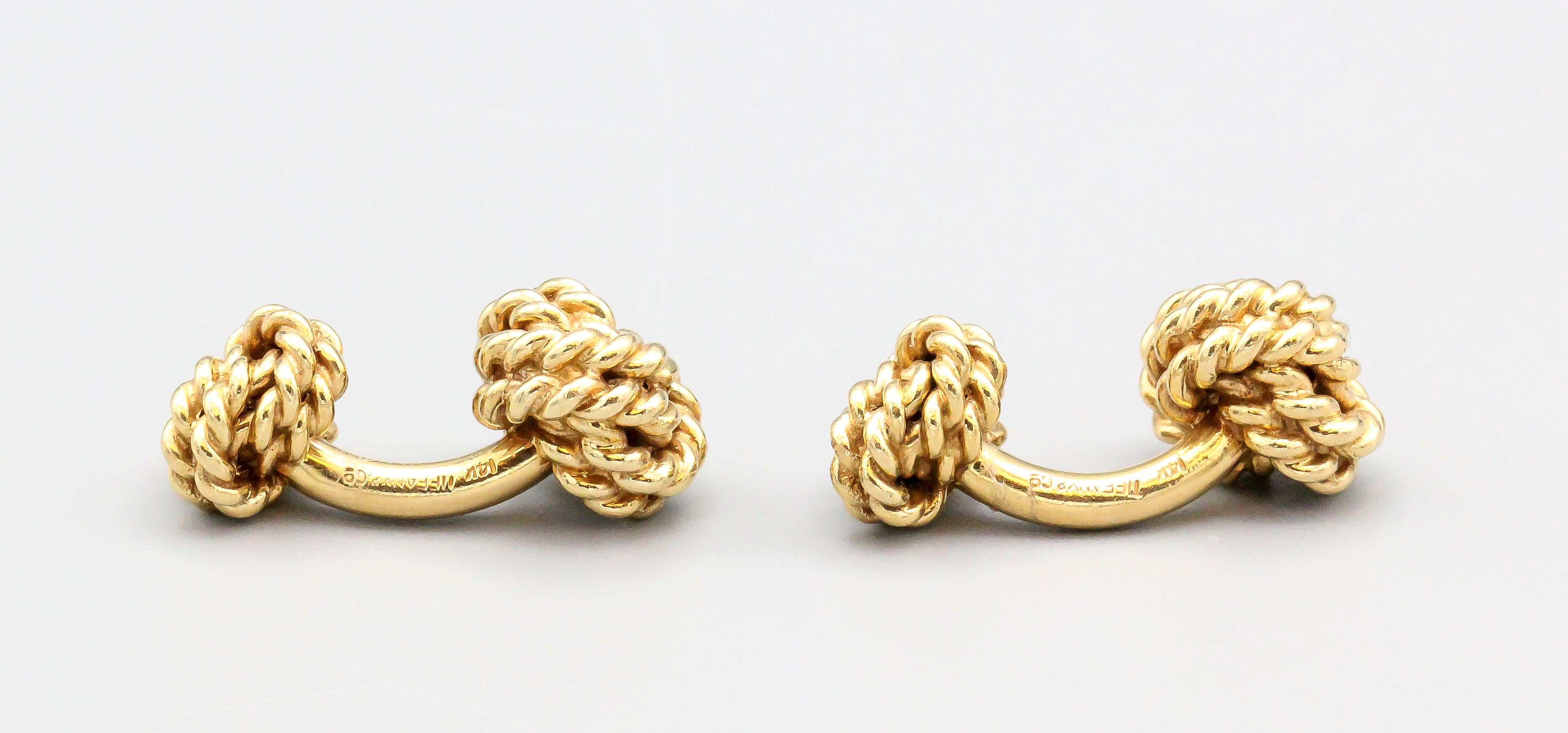 Fine pair of 14K yellow gold rope knot cufflinks by Tiffany & Co. Beautifully made and easy to wear.  

Hallmarks: Tiffany & Co., 14k.