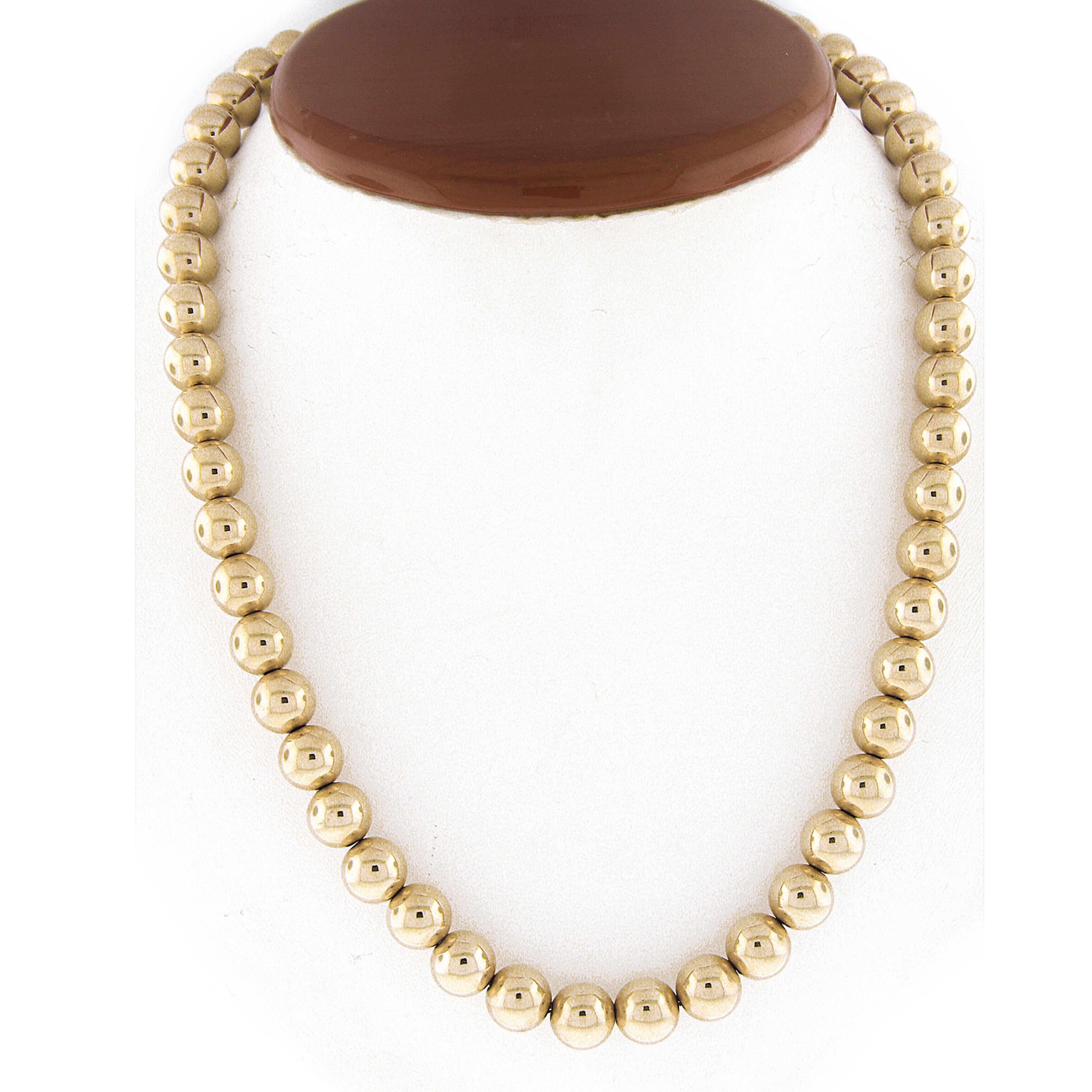 Material: Solid 14k Yellow Gold
Weight: 46.59 Grams
Chain Type: 8.7mm Polished Gold Beads
Length: 18 Inches (wearable length)
Width: 8.7mm
Clasp: Lobster Claw
Signature: Tiffany & Co. 585
Condition: Designer. Shows some light surface wear. Original