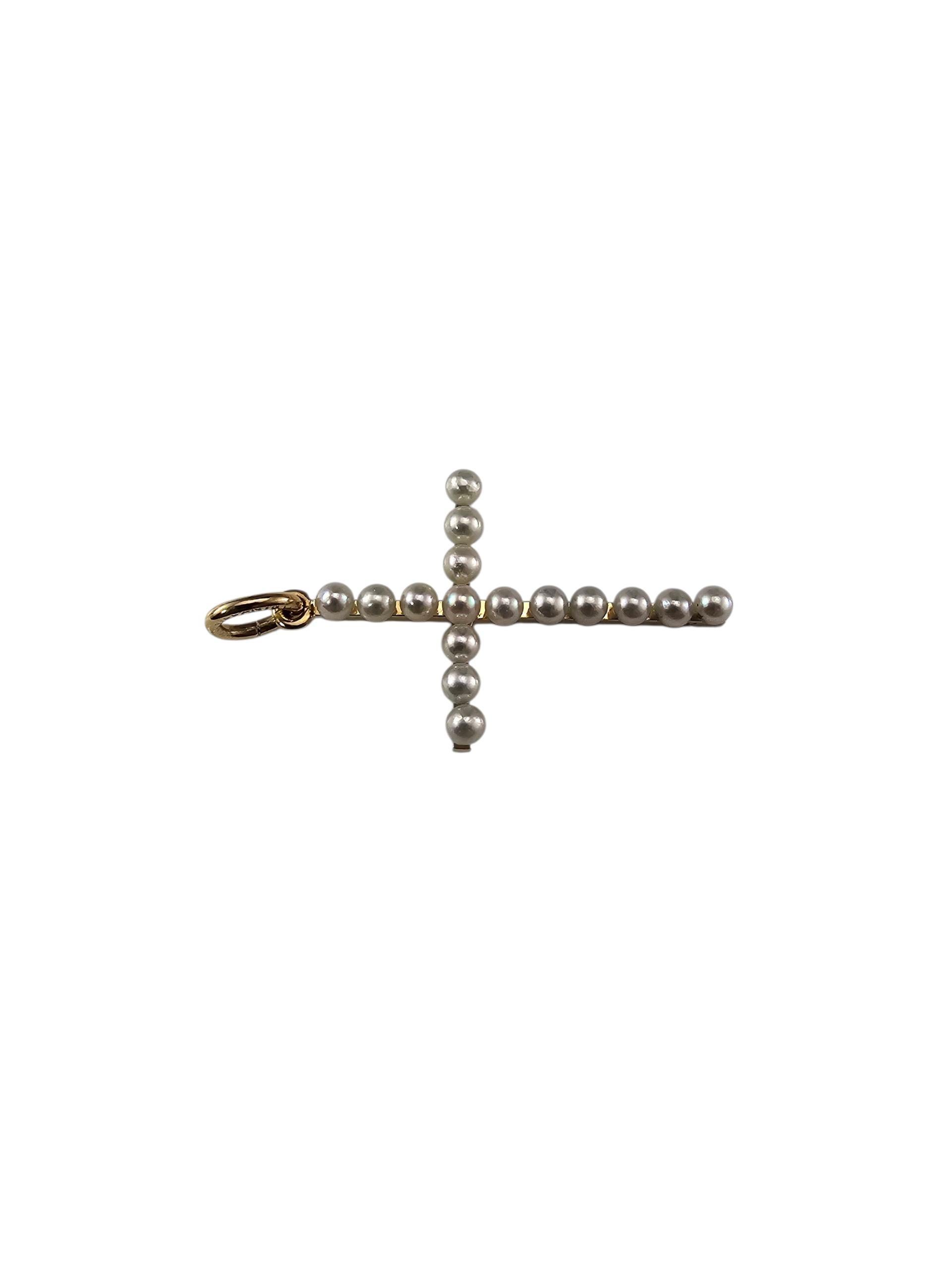 Pendentif croix en or jaune 14K et perles Tiffany & Co.

Elegant et intemporel, ce pendentif en forme de croix de Tiffany & Co. est réalisé en or jaune 14 carats et serti de 16 perles de culture rondes parfaitement assorties. Chaque perle est