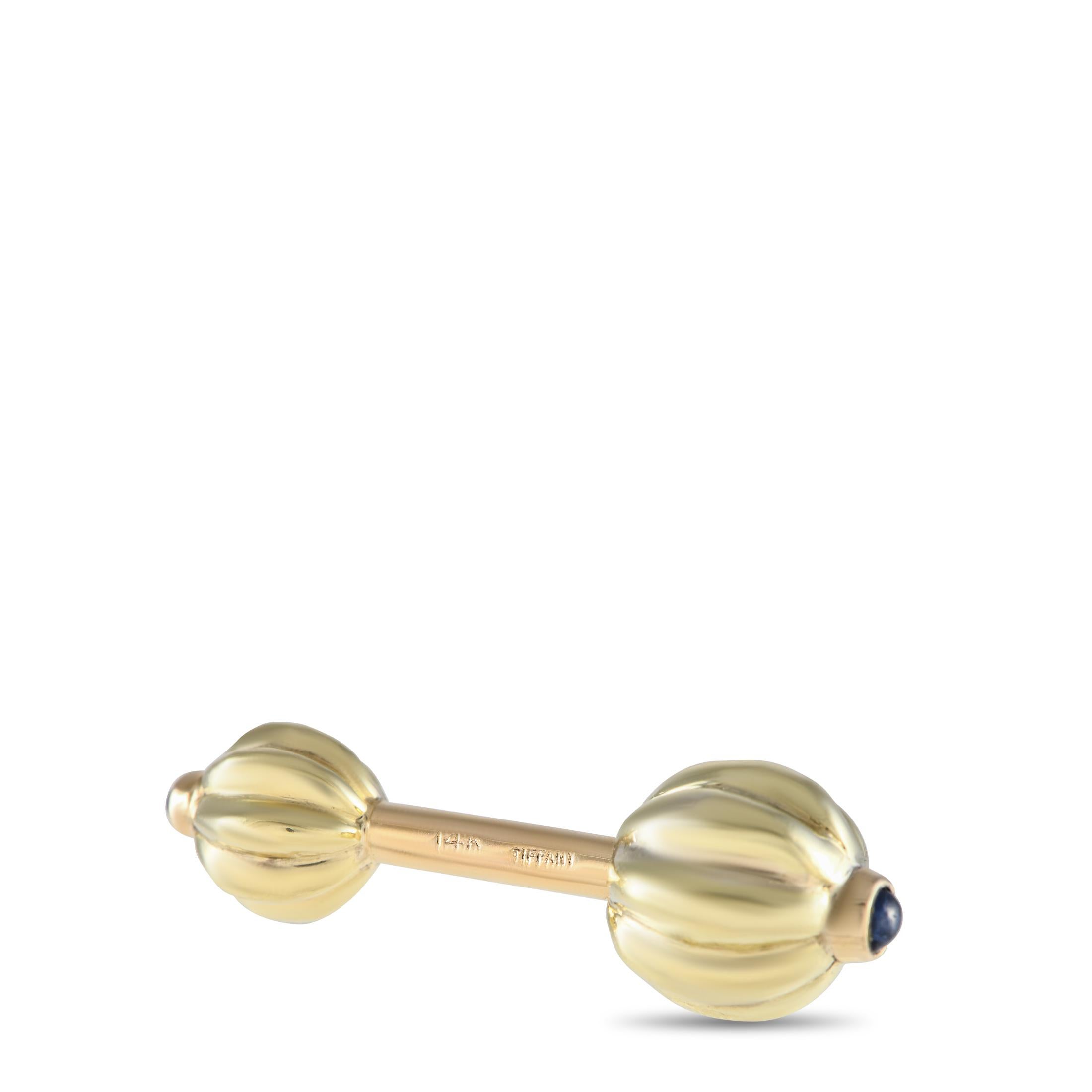 Here is a pair of bar-style cufflinks with ridged ball ends punctuated by a sapphire cabochon. From Tiffany & Co., this men's accessory is bound to add a debonair detail to formal wear.Offered in estate condition, this pair of Tiffany & Co. 14K