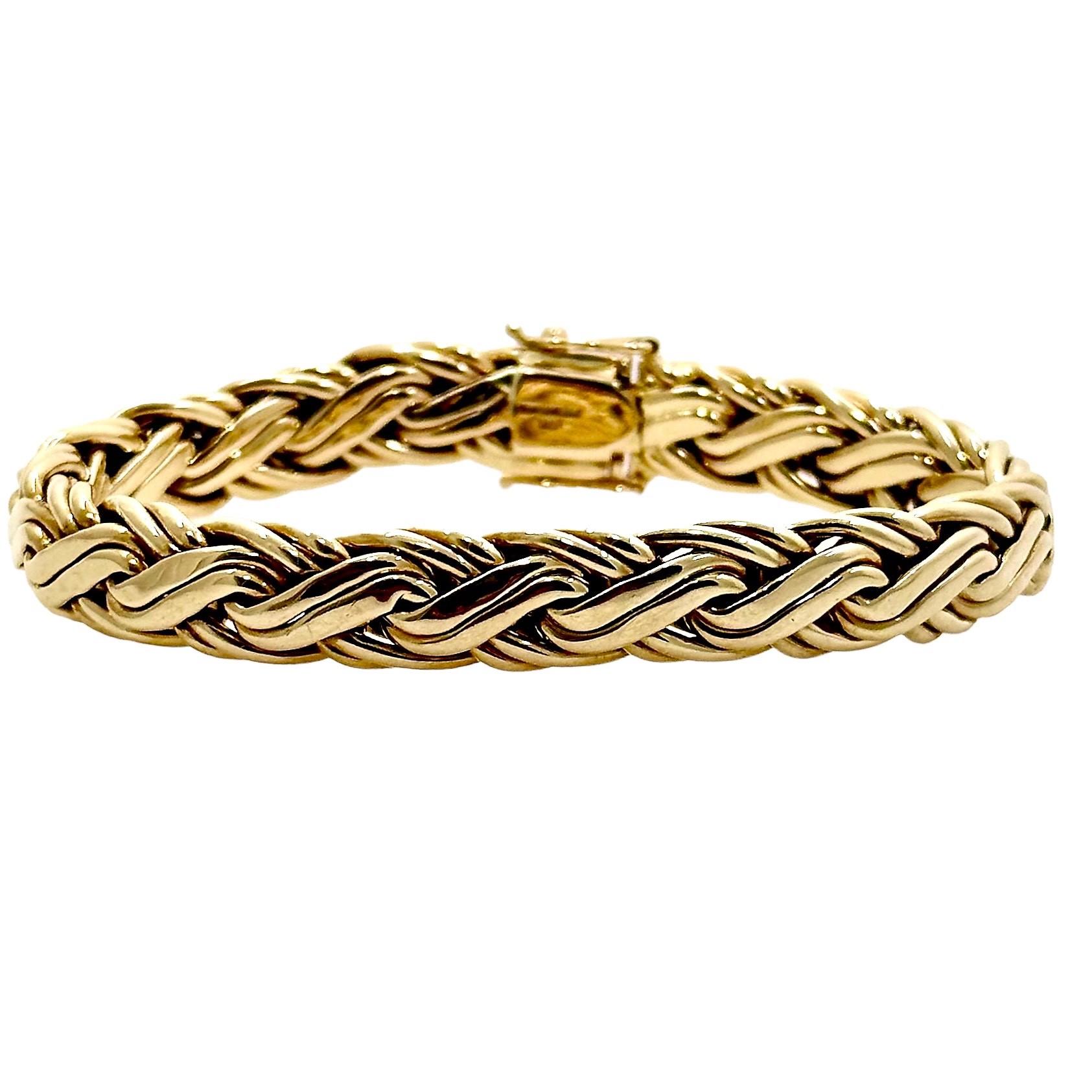This well crafted, high polish finish, Tiffany & Co. braided wheat link bracelet would be a wonderful addition to any casual jewelry wardrobe. It measures 7 3/8 inches in length by 3/8 inches in width. The box clasp closed tightly, and  there are
