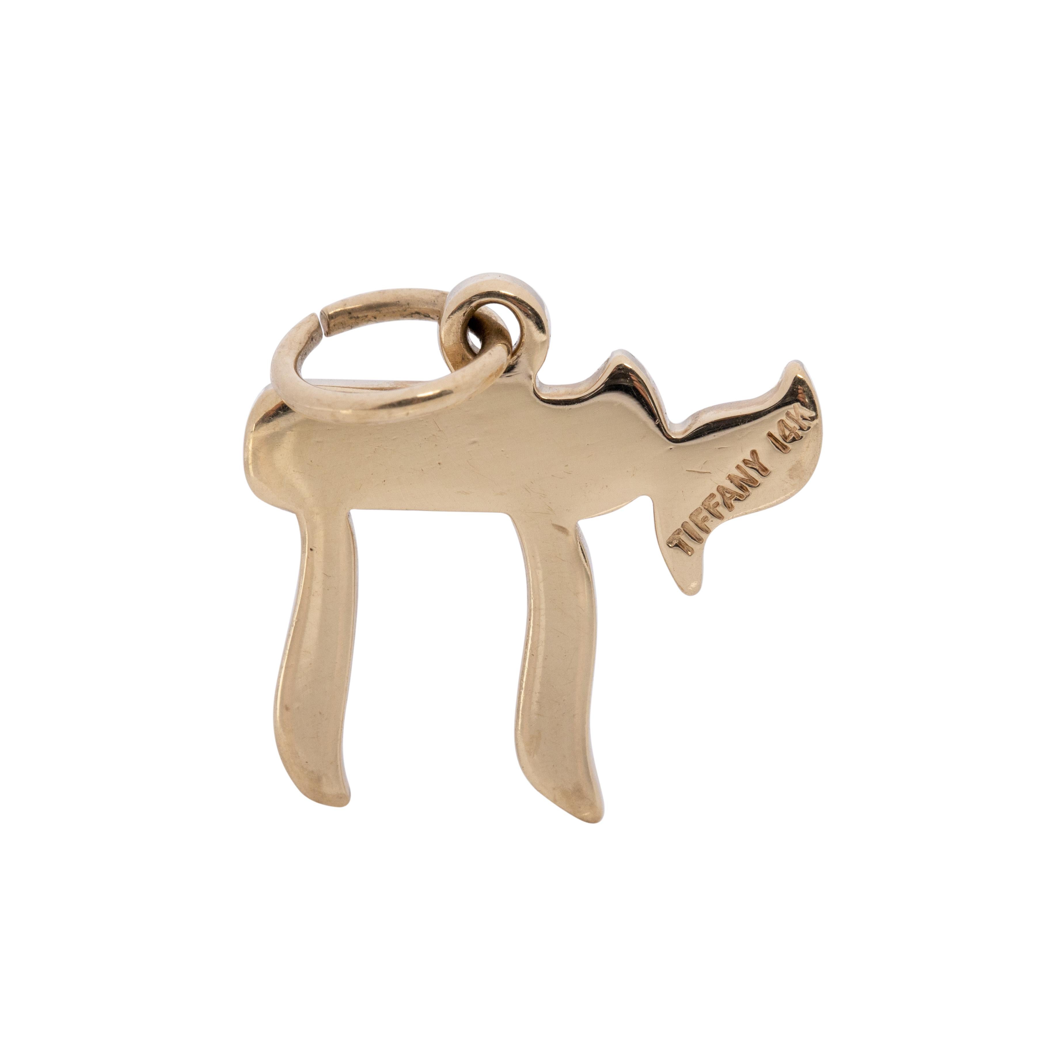 Here we have a beautiful Tiffany & Co. 14K yellow gold Chai symbol. This is the Jewish symbol for life. It also anticipates all good things to come. A wonderful meaning and a well crafted charm.   (Metal  has been tested in shop with Kee Gold Corp
