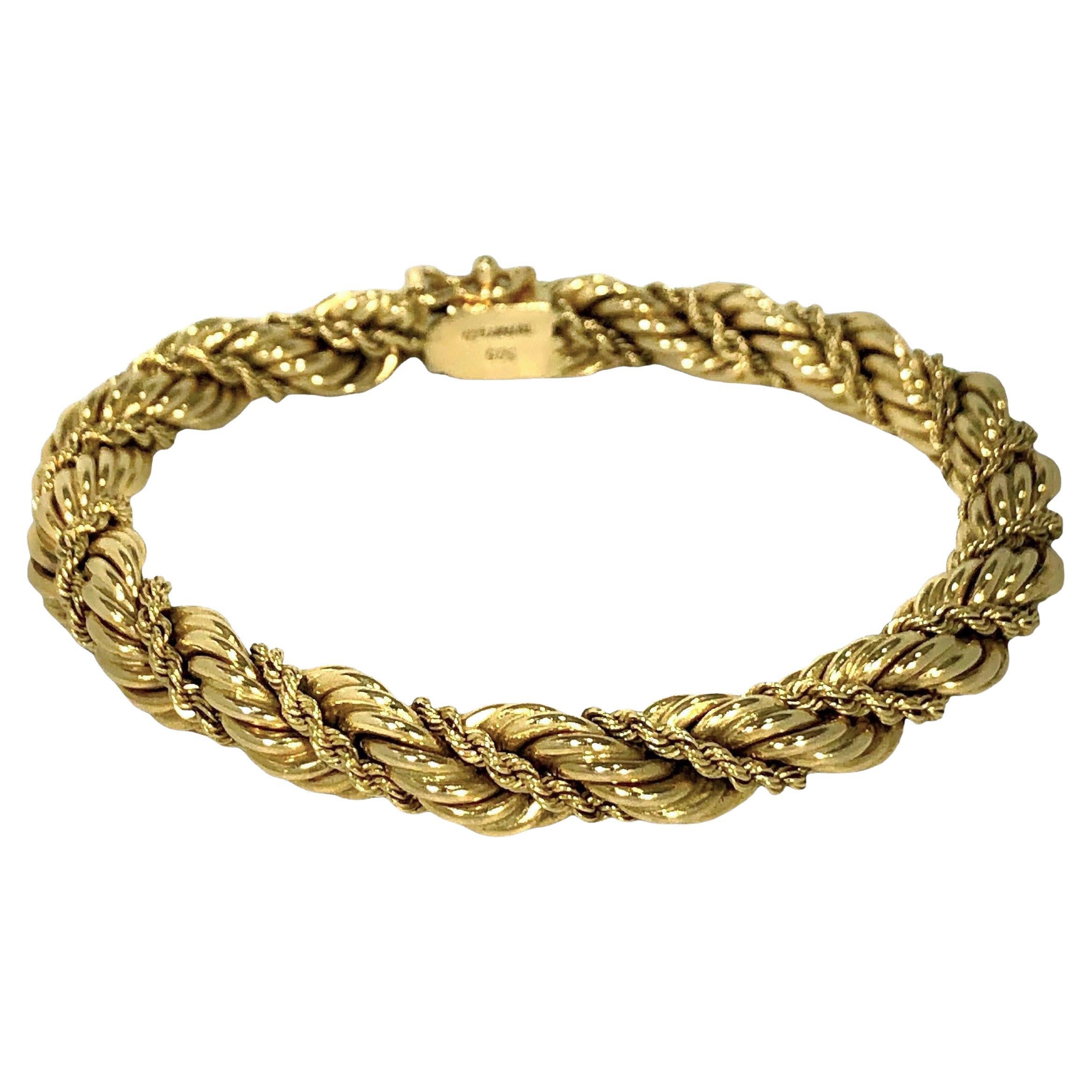 This wrapped and twisted rope bracelet by Tiffany & Co., is a beautiful example of the absolute best of the genre. Made of 14K gold and most probably manufactured in Germany during the Mid-20th Century, it is a true classic. The 1/4 inch wide heavy