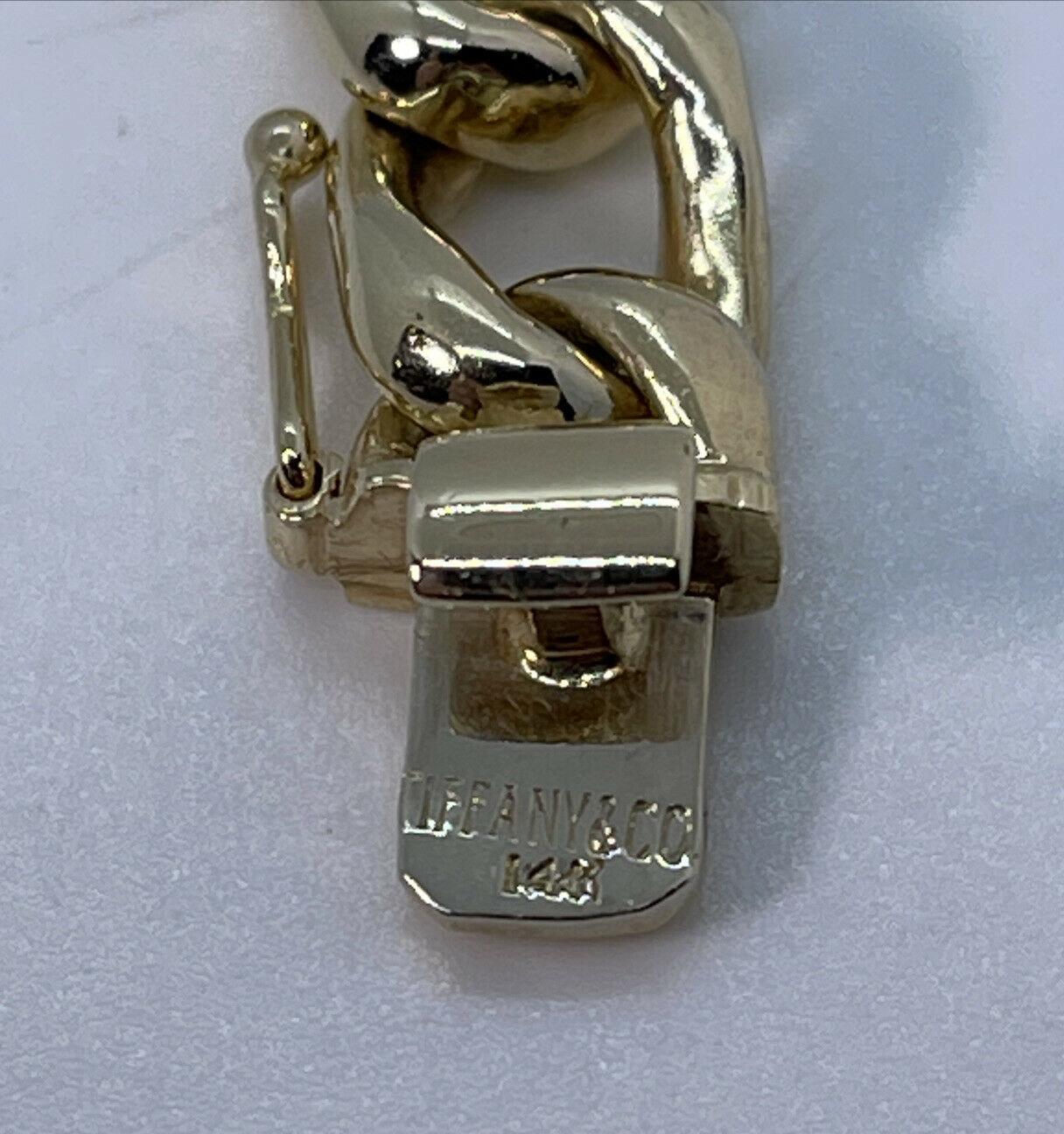 Tiffany & Co. Vintage 14k Yellow Gold Curb Link Bracelet

Here is your chance to purchase a beautiful and highly collectible designer bracelet.  Truly a great piece at a great price! 

The length is 7 inches.  The links are 10.3 mm in thickness.  Th