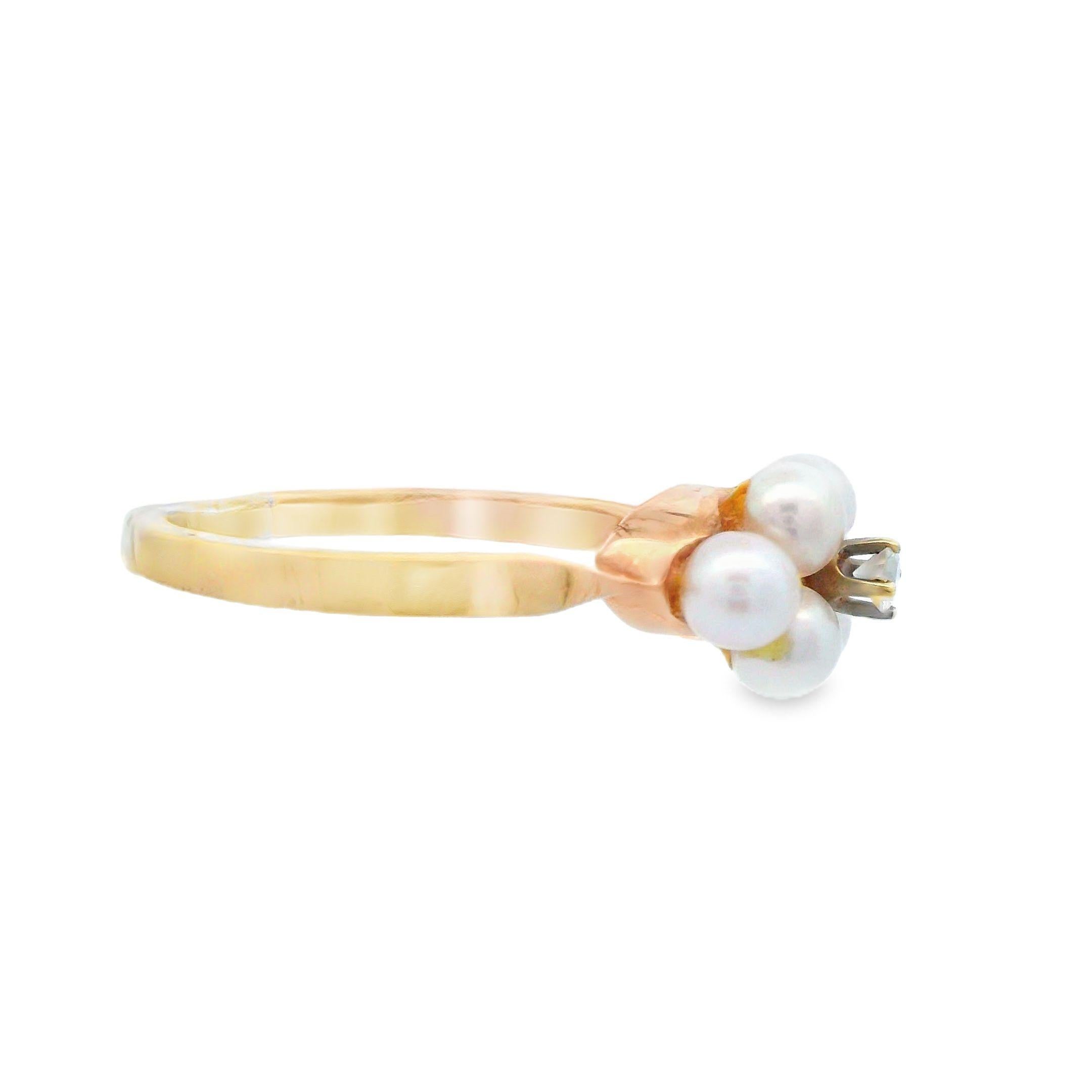 This stunning 14k yellow gold ring is made by the world renowned Tiffany & Co. and features pearl with a diamond centerstone. This unique combination of materials is the perfect blend of natural wonders and elegance. Fun and durable enough to be