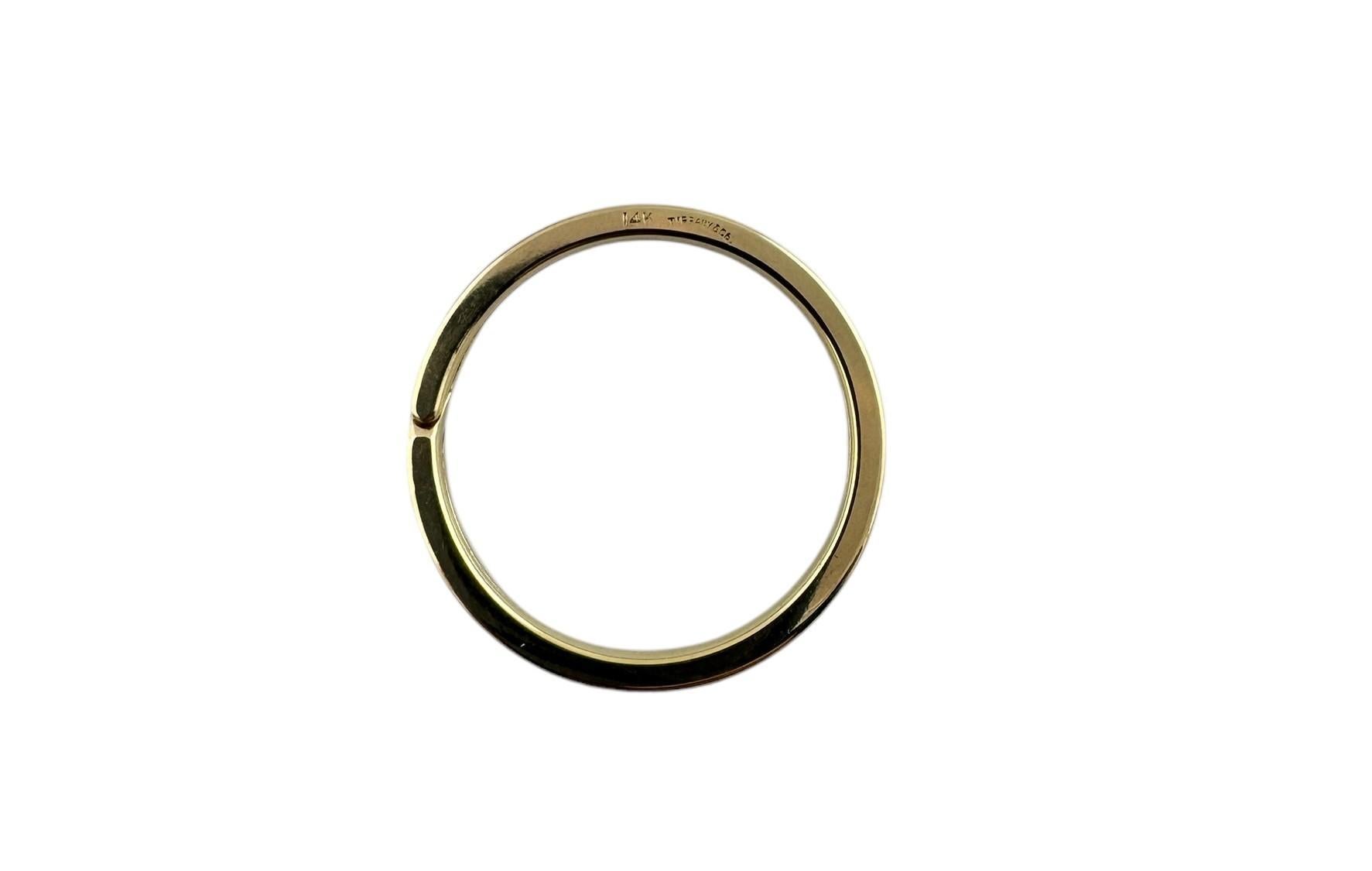 Tiffany & Co. 14K Yellow Gold Key Ring

This vintage gold key ring is set in 14K yellow gold

30.5 mm in diameter and 2.37mm thick

Stamped 14K Tiffany & Co.

7.93 g / 5.1 dwt

Very good preowned condition

Will be shipped priority mail with