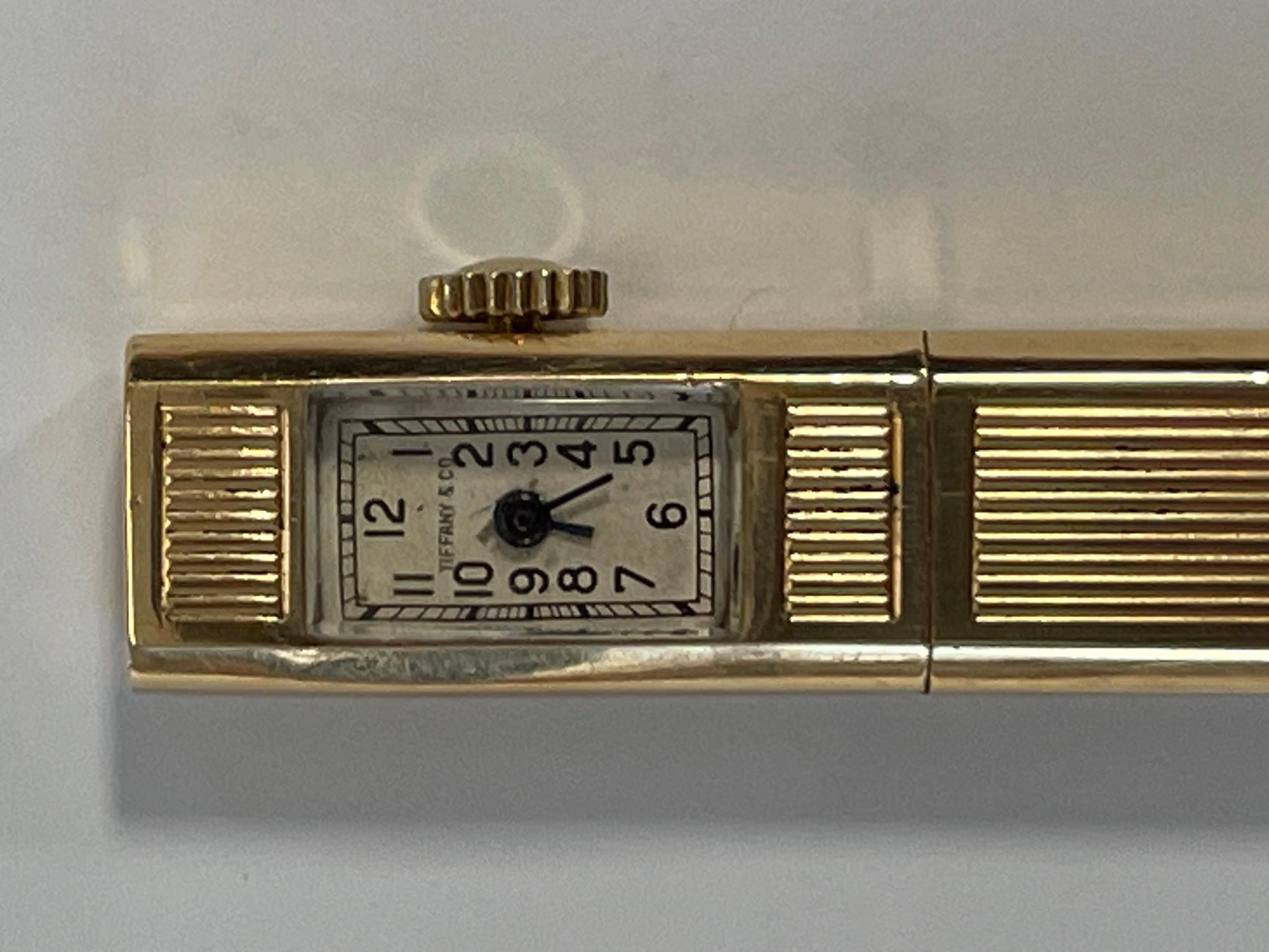 A charming little object from the 1940’s made by the venerable house of Tiffany.  Measuring 3.75” in length( 9.5 cm),  this elegant creation sports not only a working timepiece but a nubby little pencil for one’s random scribbles.  Whip it out for