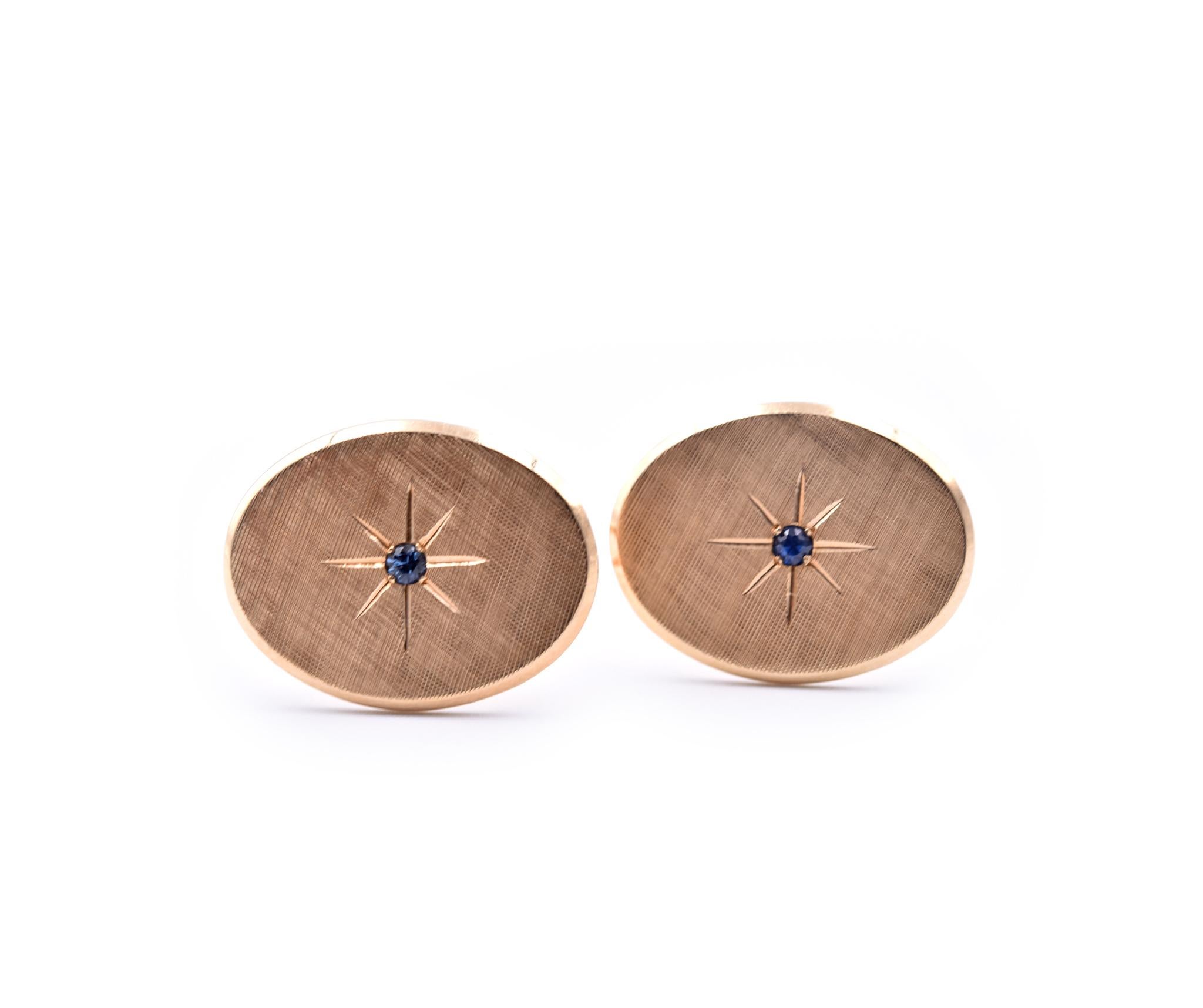 Designer: Tiffany & Co.
Material: 14k yellow gold
Sapphires: 2 round cut sapphires
Dimensions: cufflinks measure 16.60mm x 21.40mm
Weight: 11.96 grams
