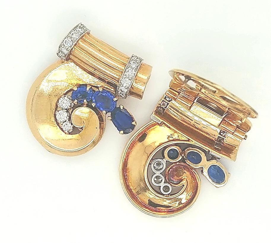 Tiffany & Co. 14 Karat Yellow Gold Retro Sapphire and Diamond Duet Dress Clips; Art Deco / Retro 
Each clip is set with: 3 oval facet cut prong set sapphires; the 6 fine bright blue sapphires have estimated total weight of 3 carats and minor