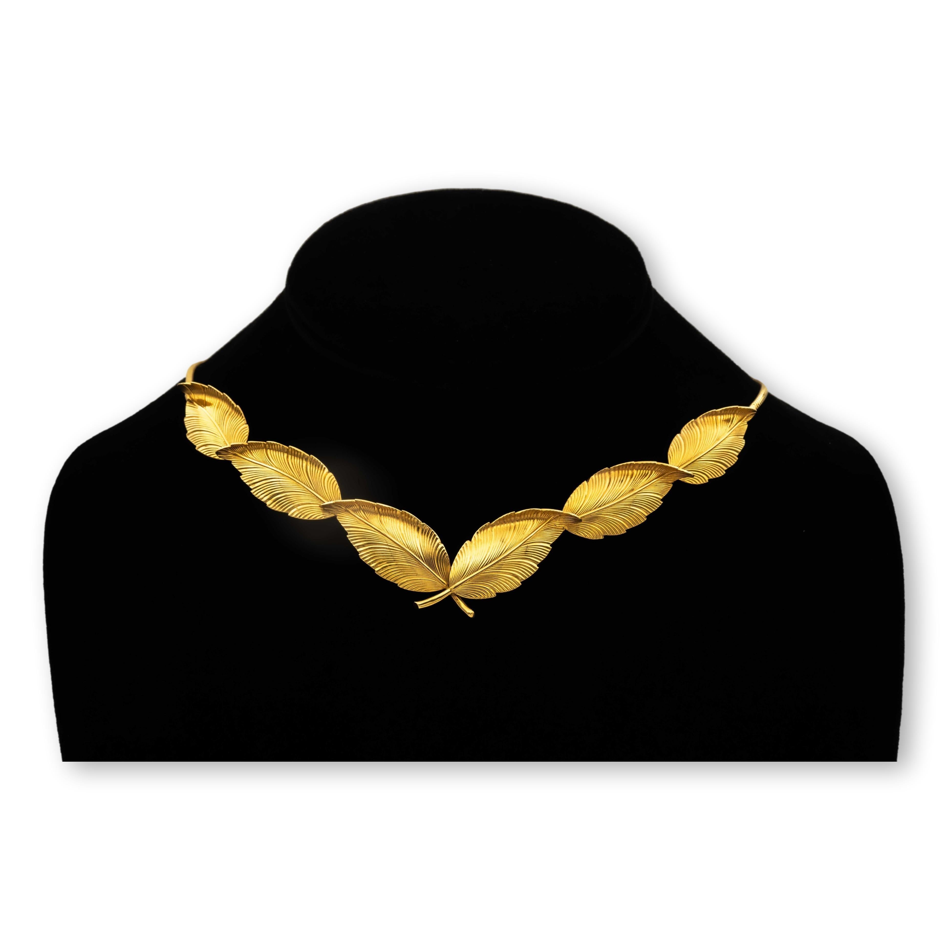 Tiffany & Co. Vintage choker necklace and earrings suite finely crafted in 14 karat yellow gold with rose overtones in a leaf motif design.  The necklace preserves its original patina. Choker necklace is 15.5