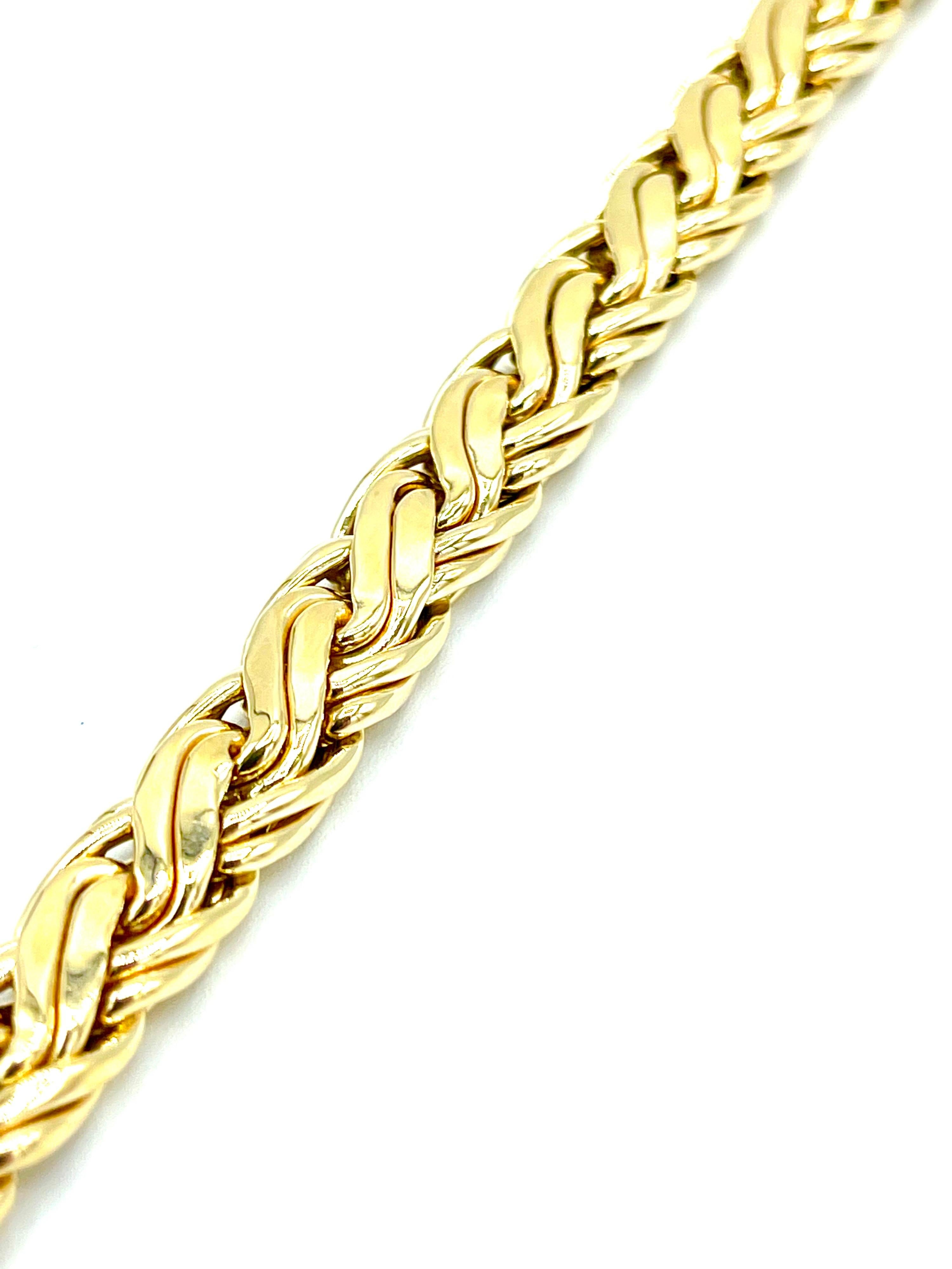 A simple and elegant Tiffany & Co. 14K yellow gold bracelet.  It is designed in a basket weave style pattern with a hidden box clasp.  The clasp is signed 