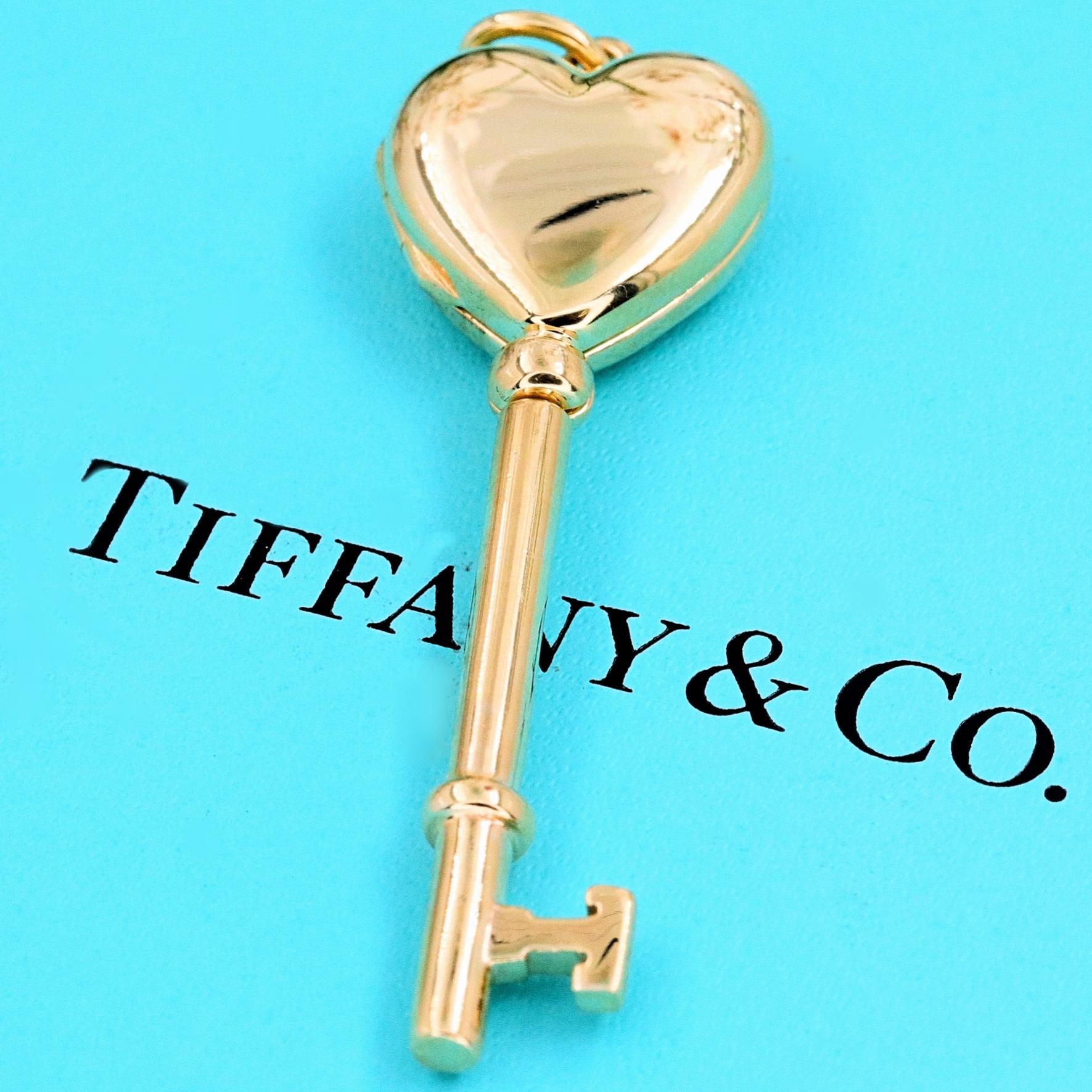Tiffany & Co.

Style:  Breakfast at Tiffany's Key Heart Locket Pendant
Metal:  585 14kt Yellow Gold
Size:  2.25 inches Length / 0.65 ' inches width / 10 mm Height
Hallmark:  ©TIFFANY&CO.585 ITALY
Includes:  T&C Blue Box

SKU#11248TATX081719
