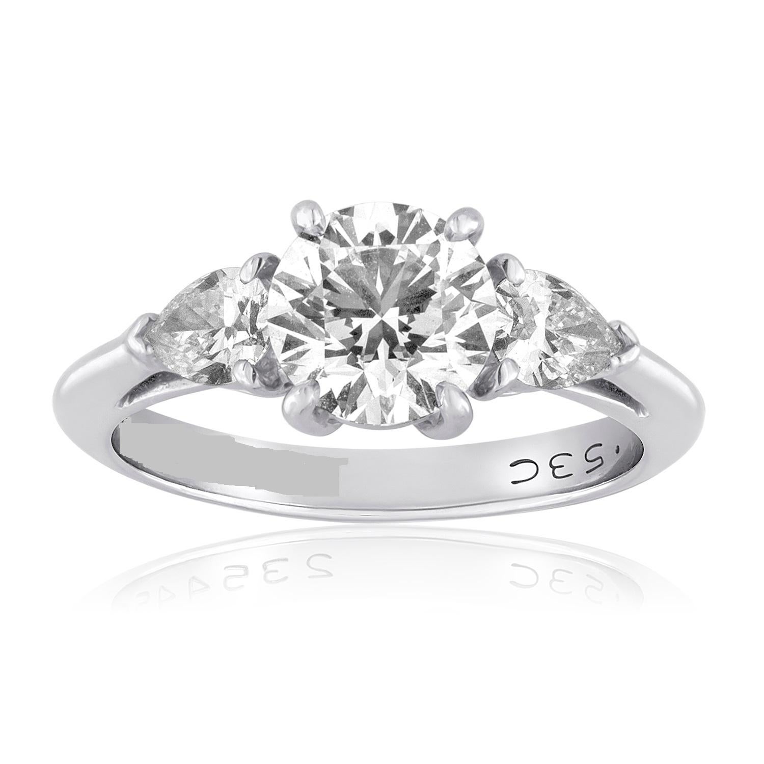 Tiffany & Co. Diamond Engagement Ring.
The ring is Platinum.
The center round stone is 1.53 Carat G VS1
The two side stones are pear shaped 0.56 Carats G VS
The ring is a size 7.25, not sizable by us.
The ring weighs 6.1 grams
T&Co. numbers have