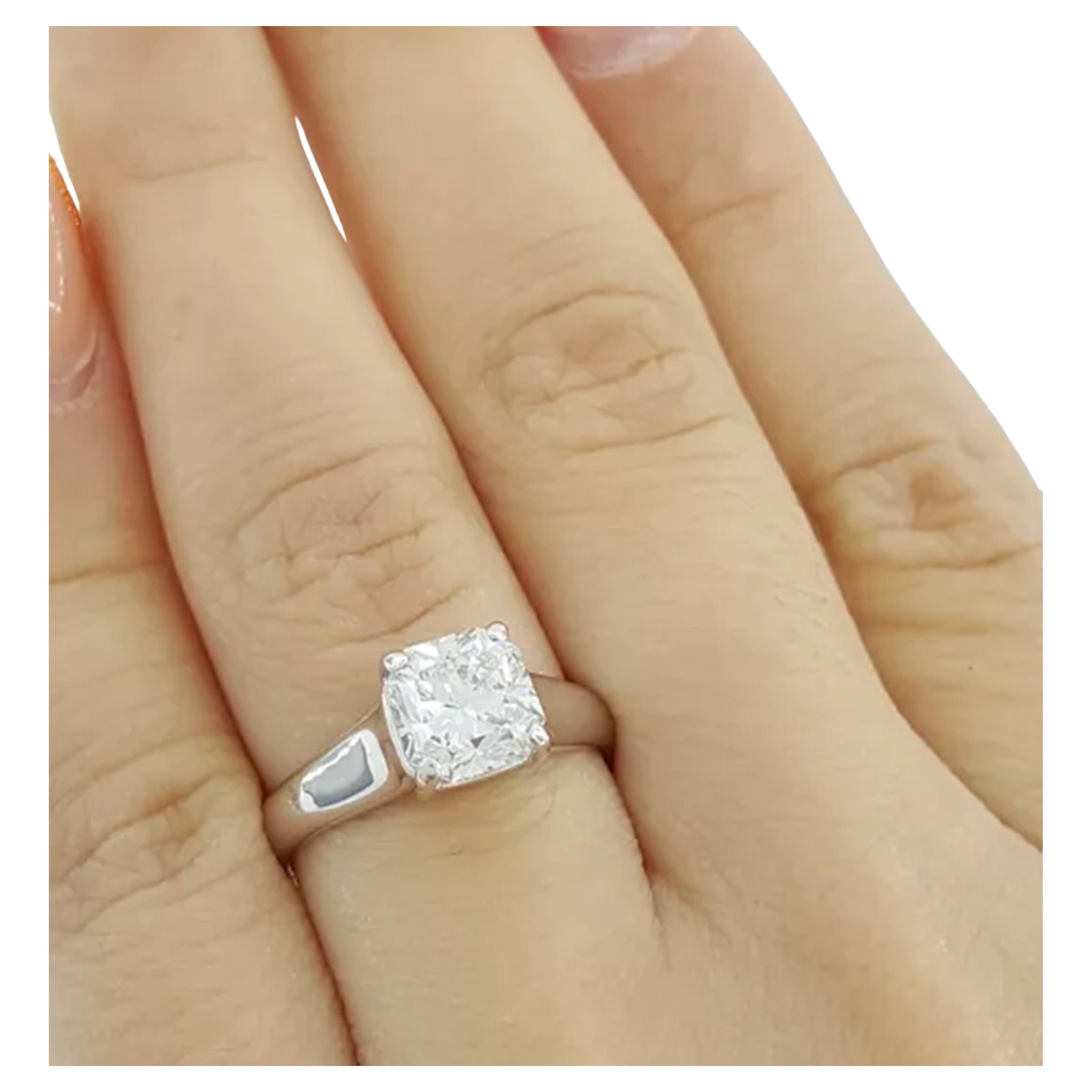 Tiffany & Co. engagement ring you described features a remarkable 1.59 carat Lucida Square Brilliant Cut diamond, which is a specialty cut unique to Tiffany & Co. This diamond has a G color rating, classifying it as near colorless, and a VVS2