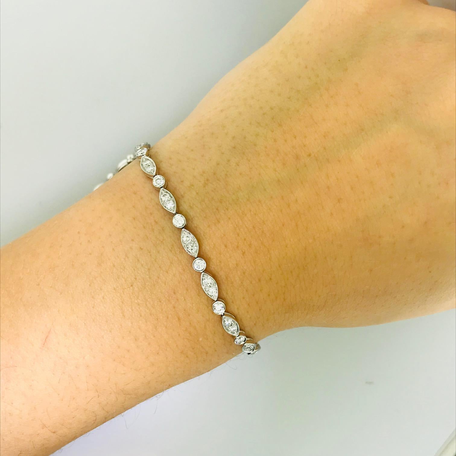 The Tiffany & Co. Platinum Diamond Jazz Bracelet is an original Tiffany and Company piece. The diamond Jazz bracelet is a modern design tennis bracelet with 1.60 carats total diamond weight. The design is a pattern of marquise shaped links in
