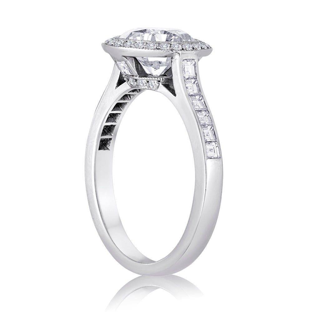 Estate Piece.
Tiffany & Co. Halo Engagement Ring.
The ring is Platinum.
The Center Stone is 1.67 Carat F VVS2.
There are 0.56 Carats F VS in Small Diamonds.
The ring is a size 6, not sizable by us.
The ring weighs 5.0 grams
T&Co. numbers are blocked