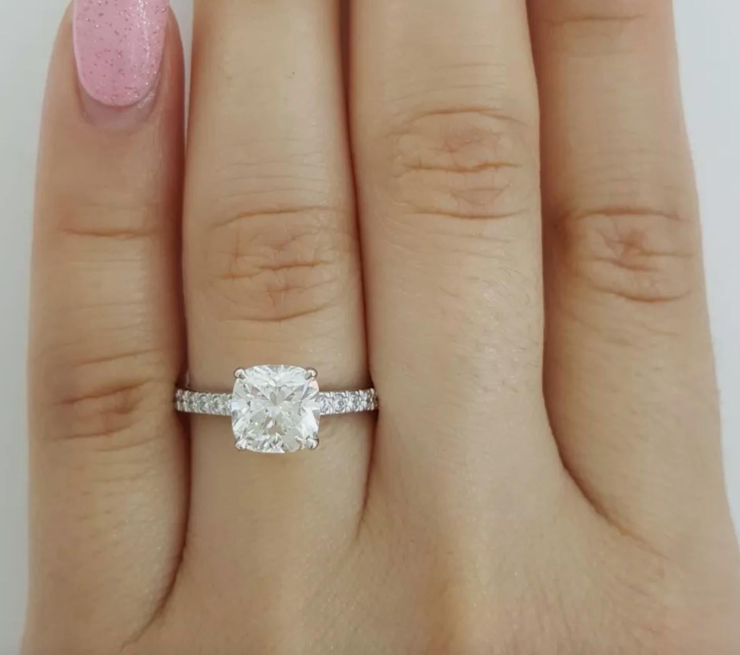 Diamond cut: Cushion Brilliant 
Carat: 1.52 carats
Measurements: 7.00 x 6.88 x 4.61 mm
Color: F
Clarity: VS2
Cut: Excellent
Polish: Excellent
Symmetry: Very Good
Fluorescence: None
Inscription: T&Co. (Serial number) on crown 

Small Diamonds
Carat: