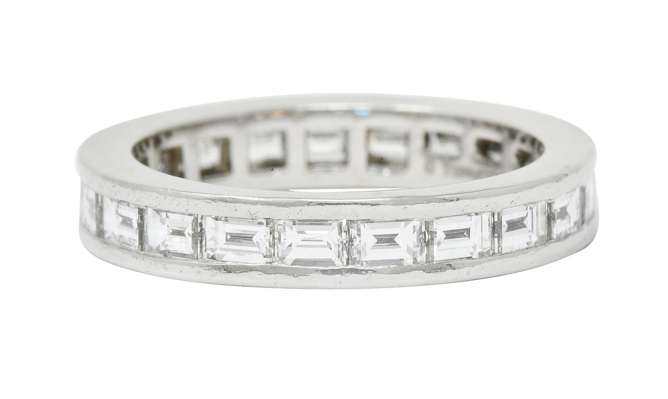 Eternity style band ring channel set fully around by twenty-one baguette cut diamonds

Weighing in total 1.68 carats, E/F color with VVS to VS clarity

Signed Tiffany & Co.

Tested as platinum

Ring Size: 5 & not sizable

Measures: 3.5 mm wide and