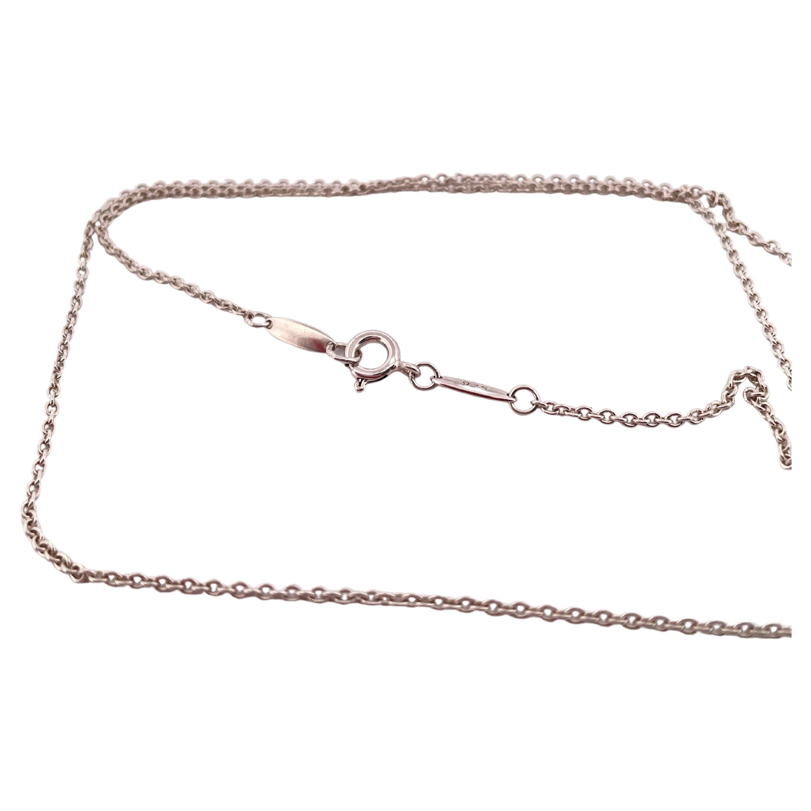 This elegant Tiffany & Co. sterling silver chain exemplifies the brand’s timeless craftsmanship and understated sophistication. Measuring 18 inches in length and weighing 2.5 grams, it is crafted from premium .925 sterling silver, offering both