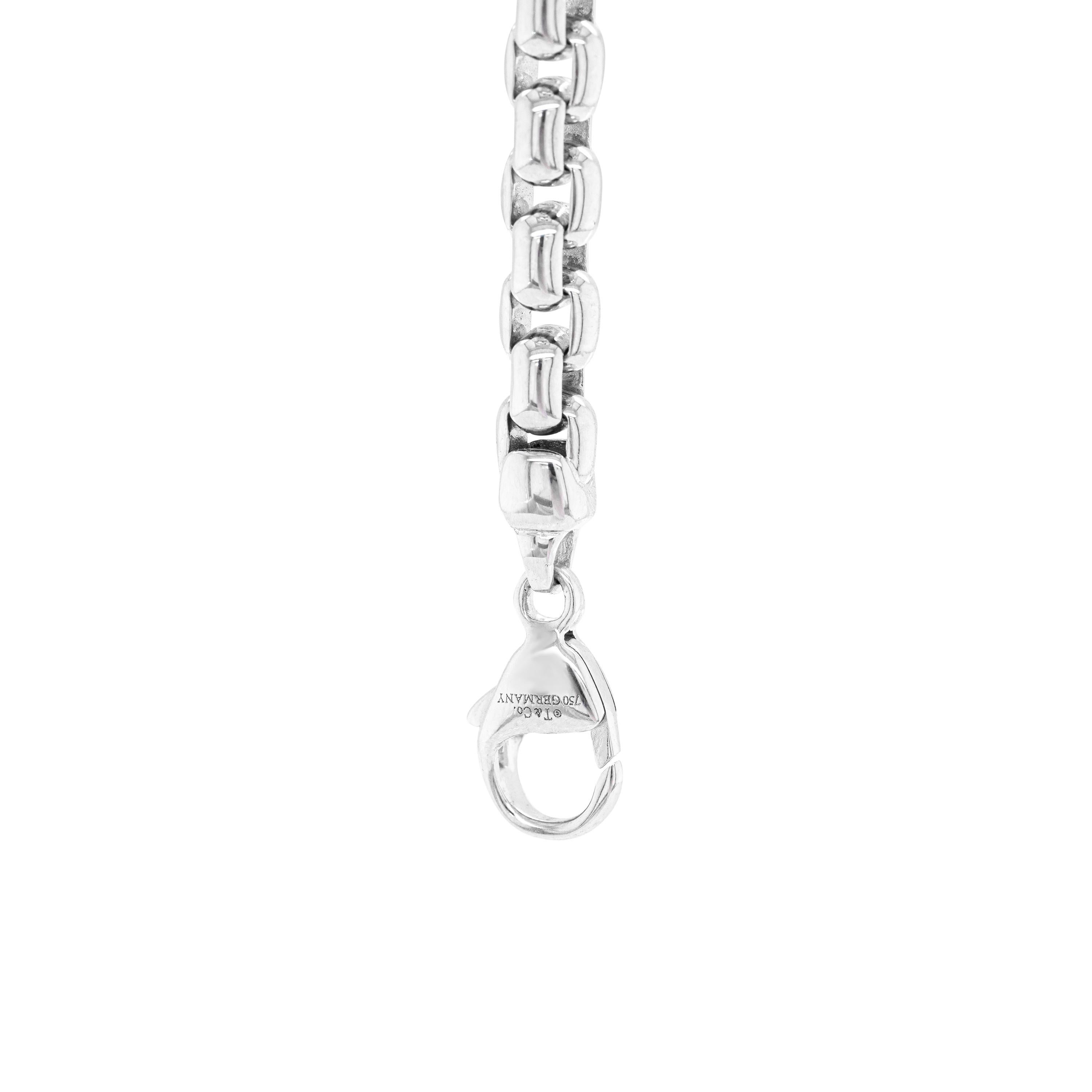 This classic chain bracelet by Tiffany & Co. features a rounded box link design crafted from solid high polish 18 carat white gold. The beautiful bracelet secures with a lobster clasp, measures 8.25