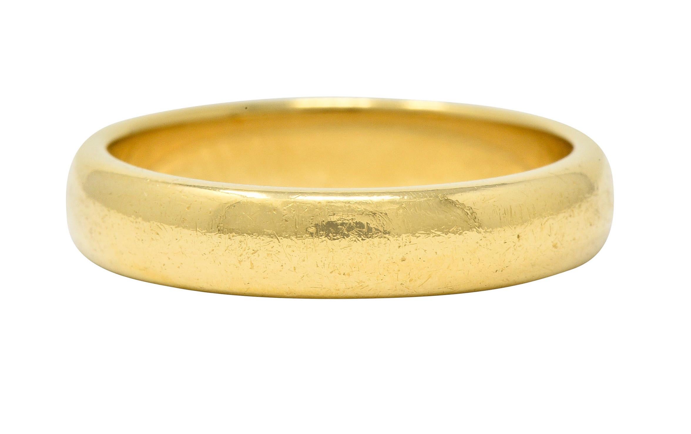 Wide band ring features a rounded curvature

With a brightly polished finish

Stamped AU750 for 18 karat gold

Fully signed Tiffany & Co.

Ring Size: 8 3/4 & sizable

Measures: 4.5 mm wide and sits 1.8 mm high

Total weight: 7.2 grams

Ideal.