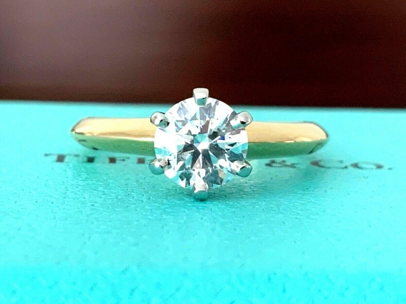 JUST IN TODAY!  

Are you looking for the HOTTEST HARDEST to find Tiffany round sold today?

Well you just found it - the Tiffany & Co Classic round set in the hard to find 18k Yellow Gold!  99% of all Tiffany Preowned Round Classic engagement rings