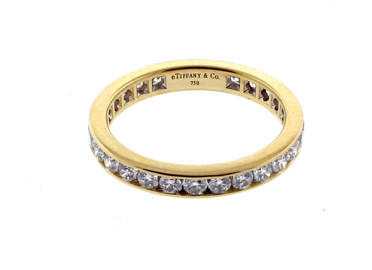 From Tiffany & Co., this classic diamond band ring. The 18 karat gold ring is 3mm wide with 28 diamonds weighing 1.12 carats. The diamonds are F-G color and VVS clarity.  Size 7, Never worn.  Retail value: 5150