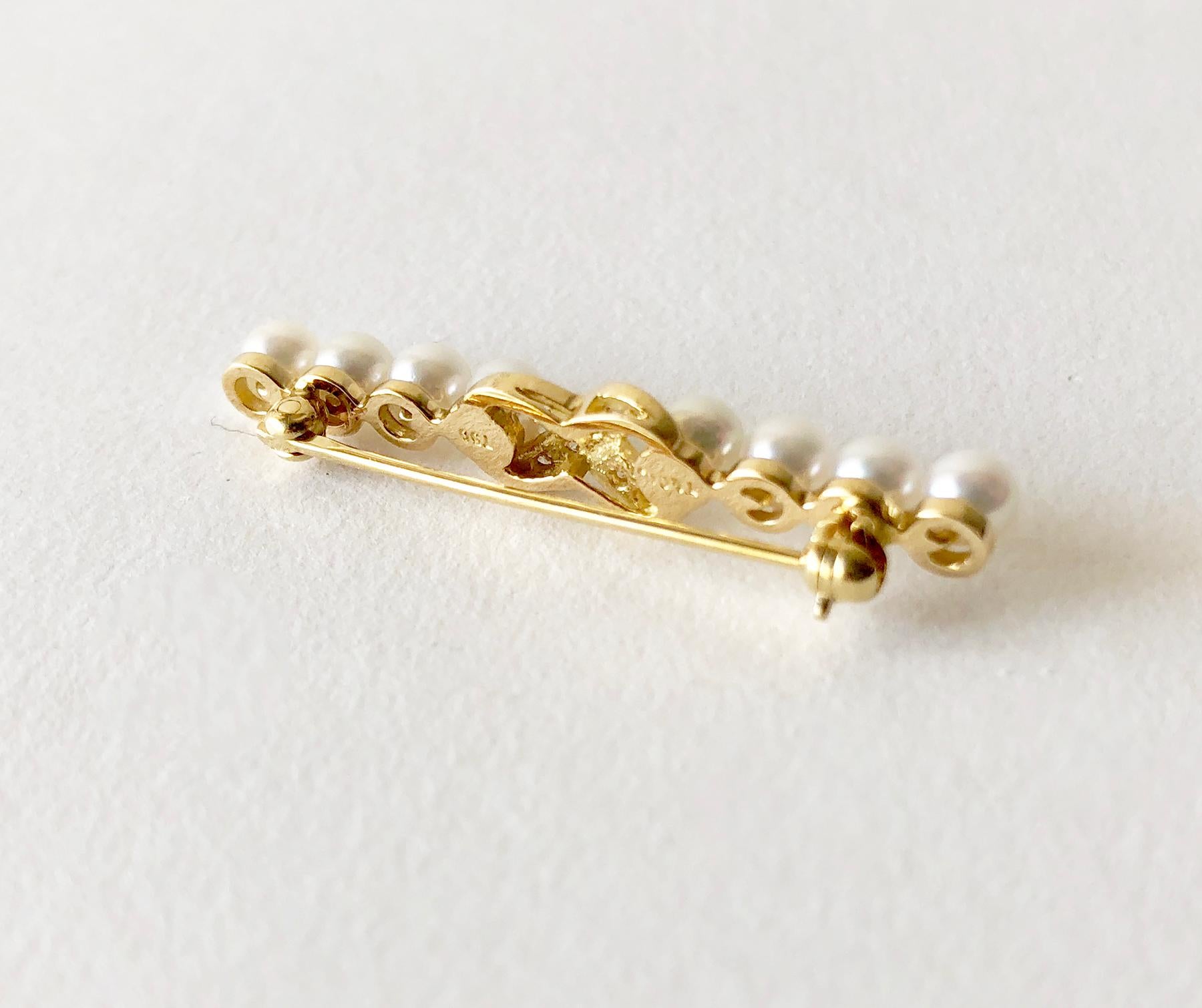 18K gold and diamond bar pin by Tiffany & Co. Brooch measures 1 1/2