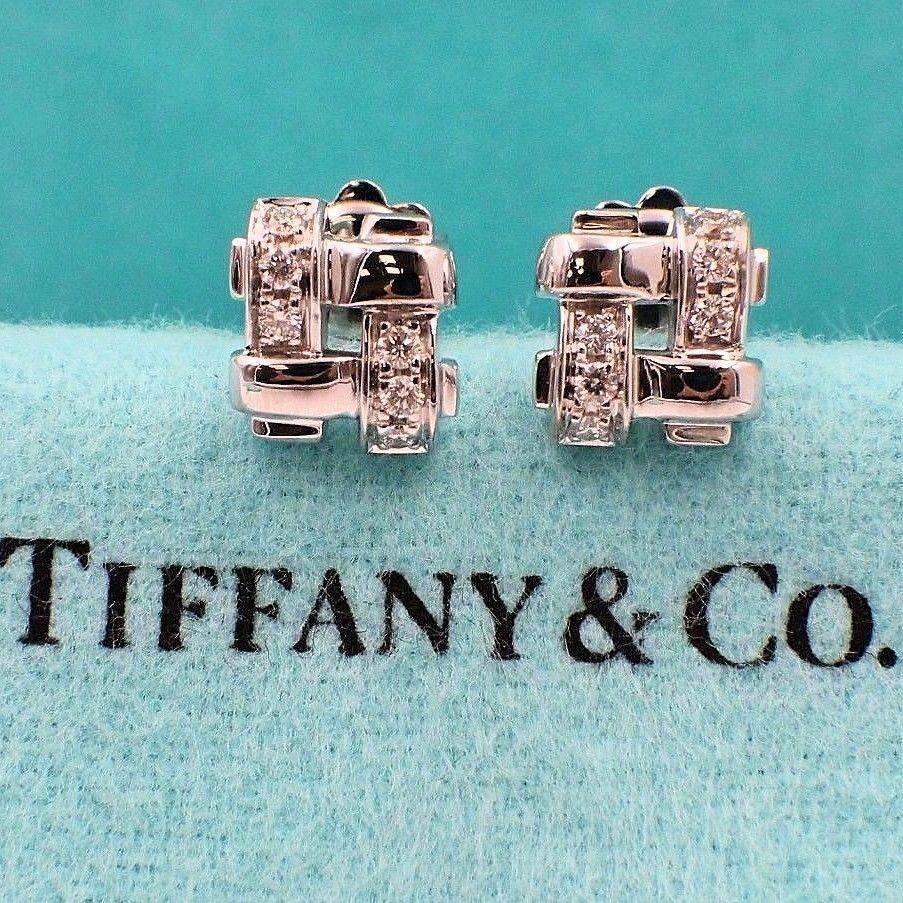 Tiffany & Co.
Style:  Vannerie Basket Weave Earrings
Metal: White Gold 18 KT
Total Carat Weight:  0.25 TCW
Diamond Shape:  Round Brilliant Diamonds
Diamond Color & Clarity:   G / VS
Size:  8 MM X 9 MM
Hallmark:  Tiffany&Co. ©2002 750 ITALY (on