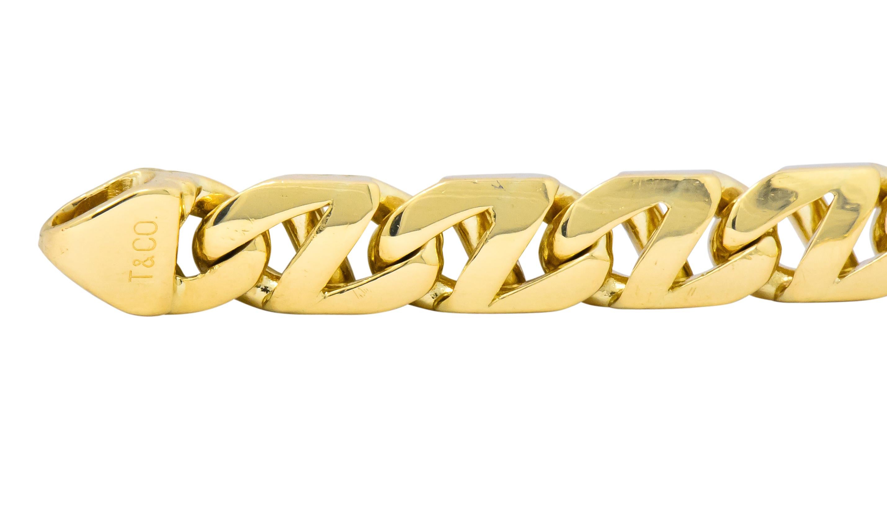 Highly polished gold bracelet with stylized mariner links

Completed by large infinity style lobster clasp

Signed T & Co. for Tiffany & Co.

Stamped Italy and 750 for 18 karat gold

Length: 8 3/4 inches

Width: 1/2 (at widest) inch

Total weight: